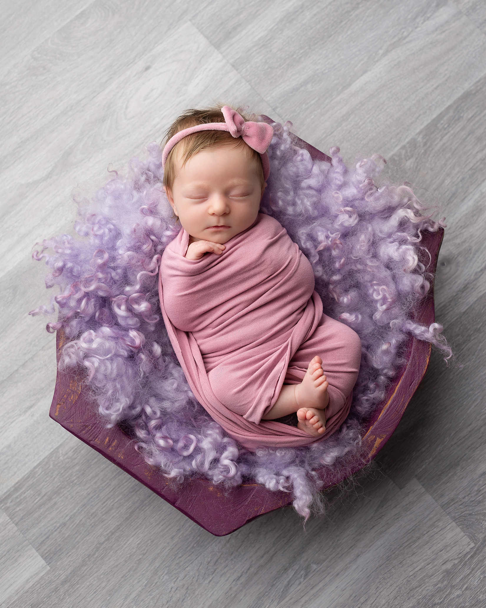 newborn-girl-pink-wrap-purple-bowl-Kingston-family-portrait-studio.png
