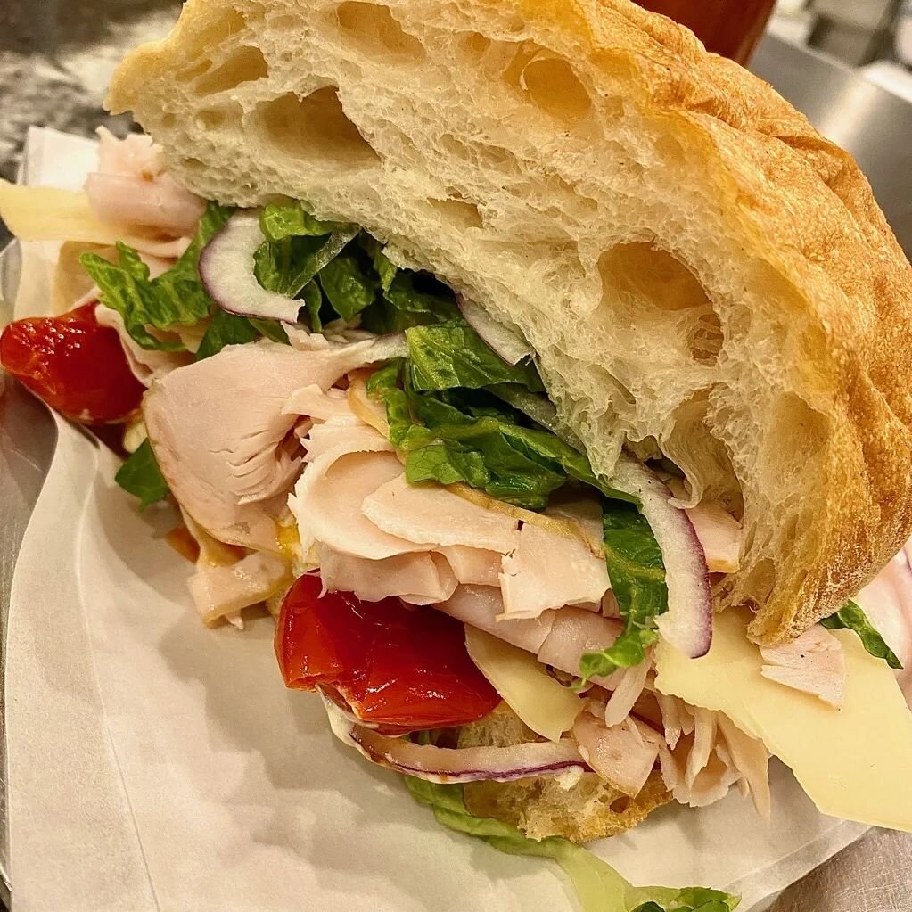 Turkey and gruyer on ciabbatta with pepper aioli, red onion, roast cherry tomatoes, and Romaine lettuce. Optional honey-garlic mustard add-on.