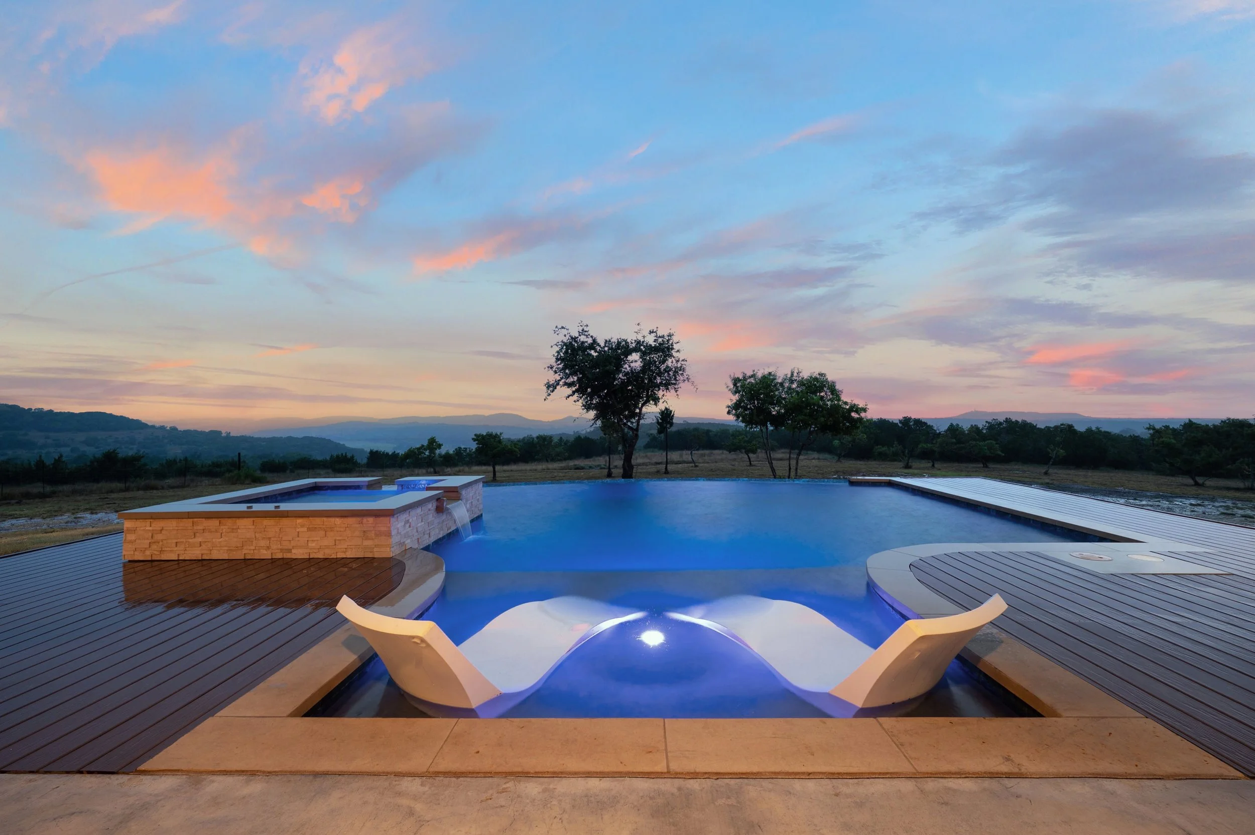 Exterior poolside photograph at twilight in the Texas Hill Country