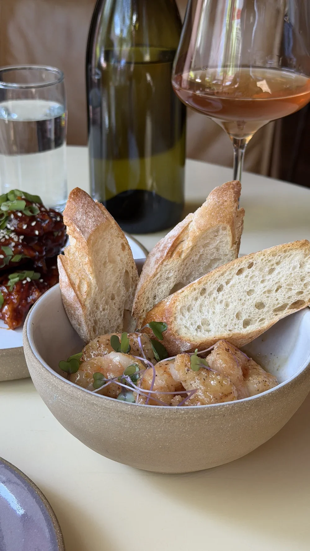 Sherry shrimp with garlic butter sauce and toasted baguette at Lula Drake Wine Parlour
