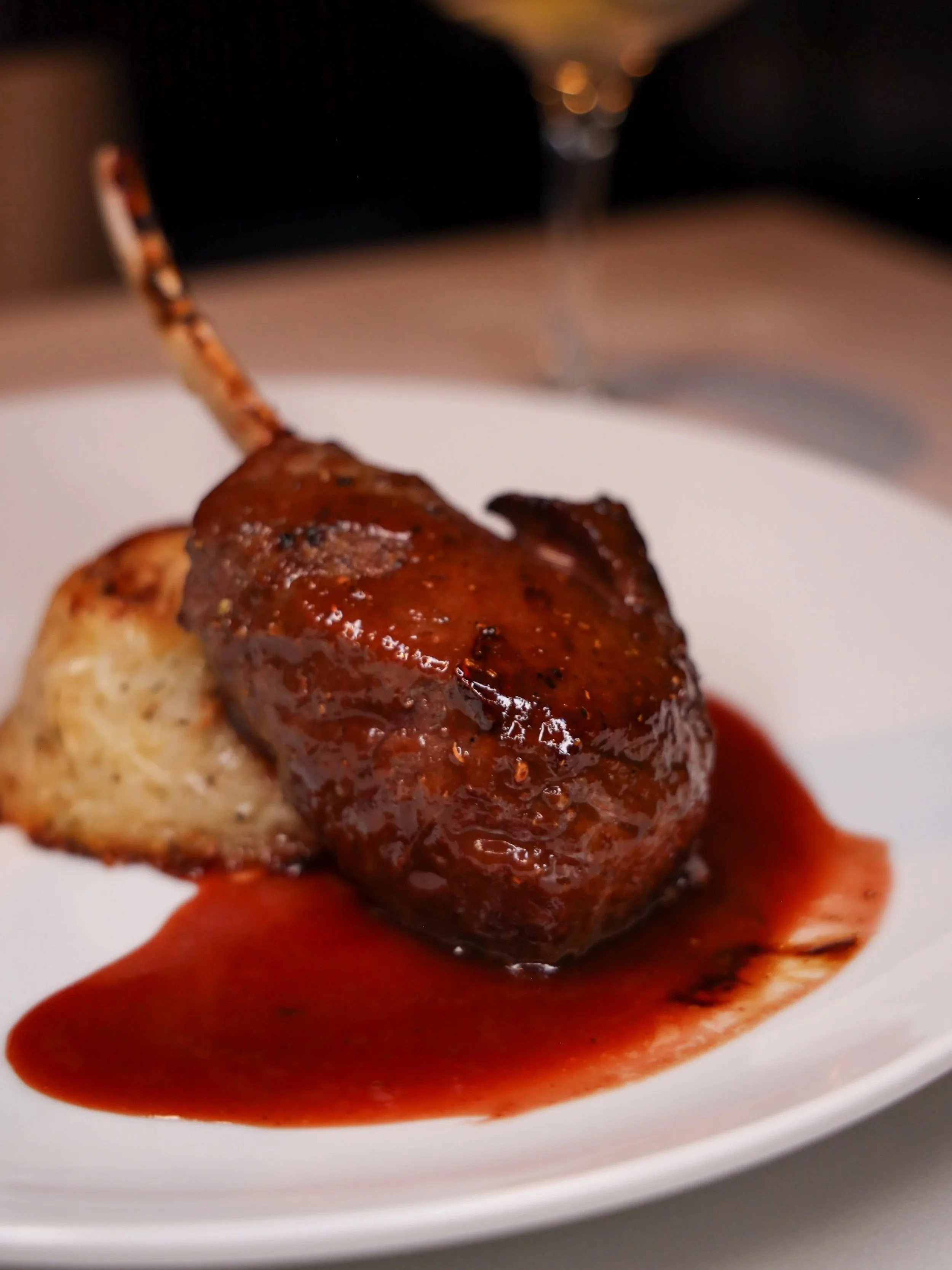 The Spiced Cervena Elk Rib Chop at Ristorante Paoletti, served with a port wine-cassis reduction and a nest of shaved potatoes.