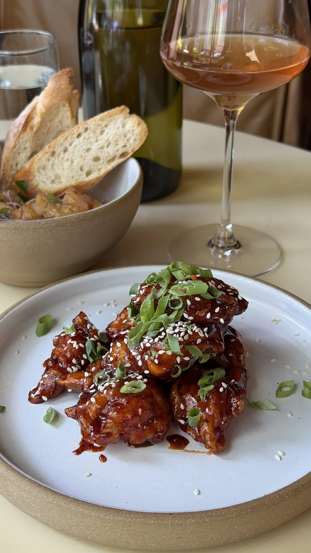 Yangnyeom Korean Fried Chicken with sesame seeds and scallions at Lula Drake