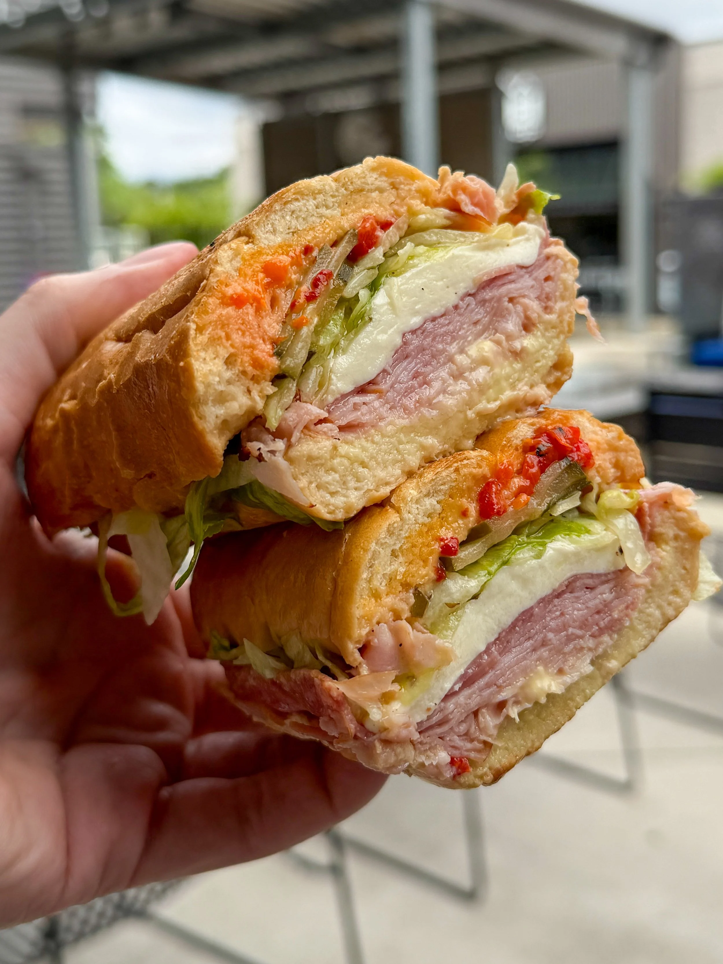 The Christine sandwich with ham, salami, mozzarella, and roasted red peppers at Bull & Bread in Columbia