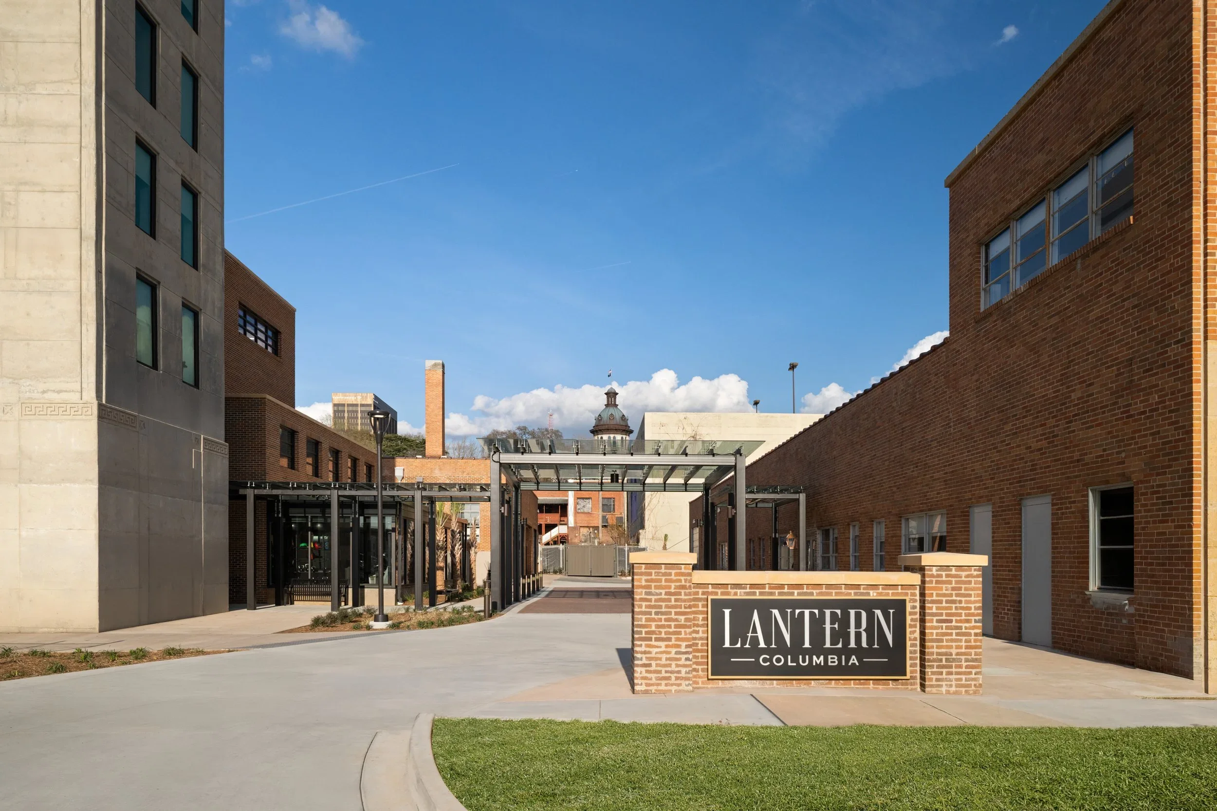 Lantern Columbia entrance signage with the State House dome visible in the background