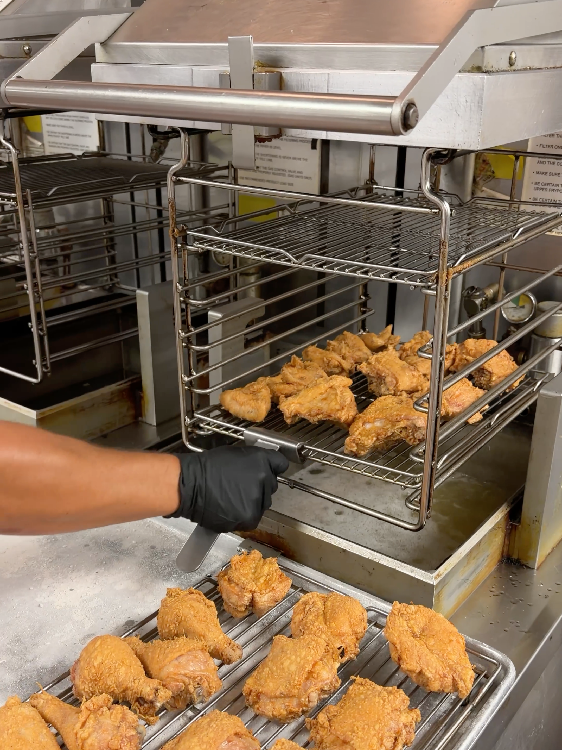 Freshly broasted chicken pulled from the pressure fryer at Bernie's Chicken in Columbia
