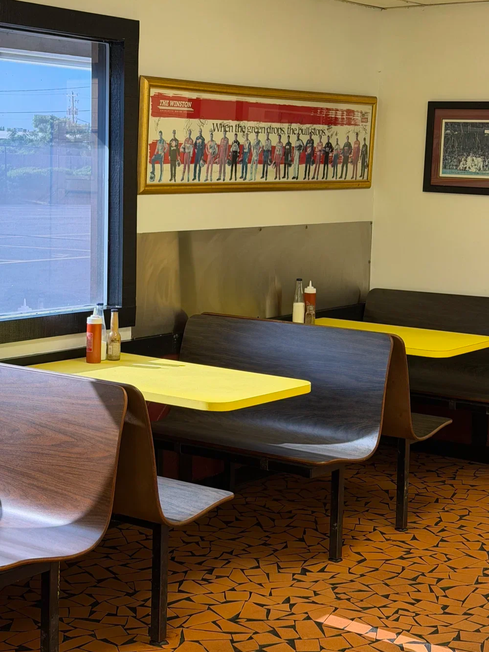 Retro dining room booth with yellow tables at Bernie's Chicken in Columbia