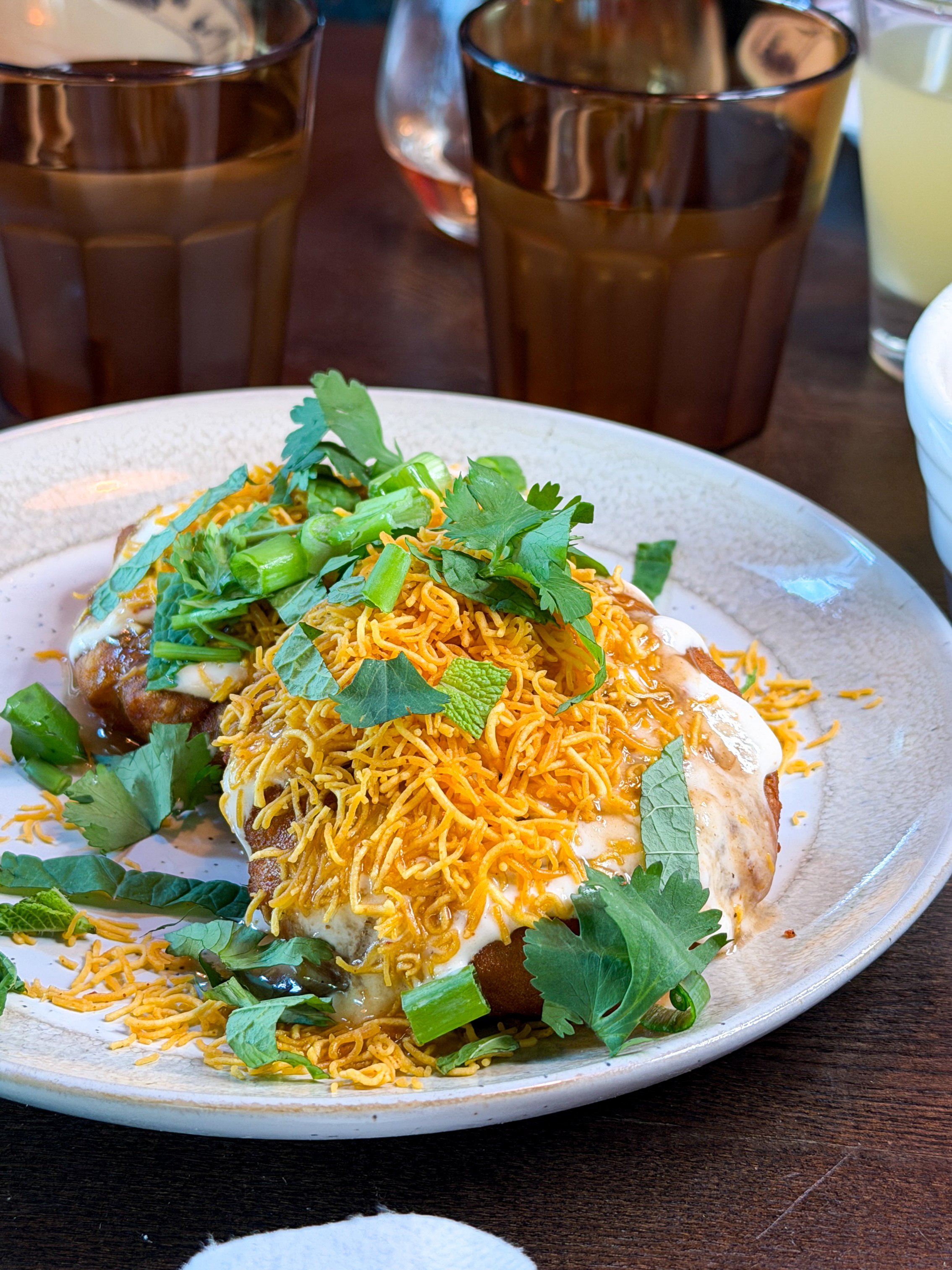 Potato Mochi Chaat topped with yogurt, tamarind chutney, and crispy sev at Little Secret