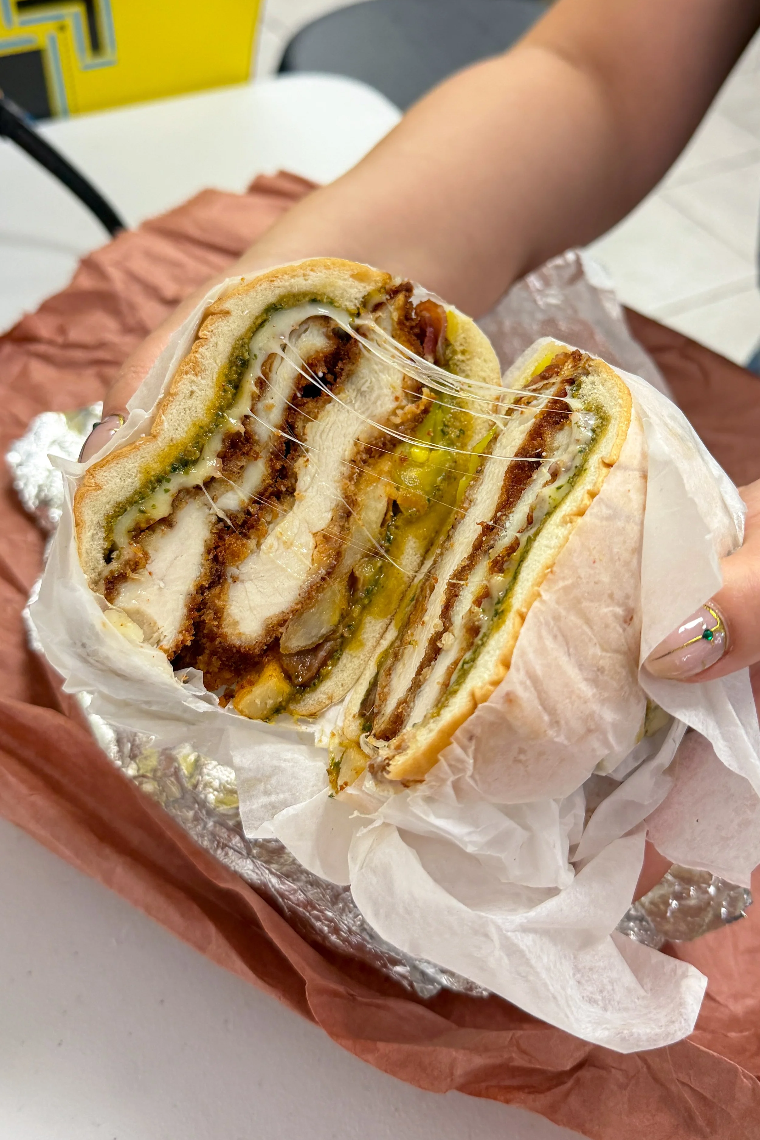 The Fatboy sandwich at Mochi's Deli in Charlotte, a chicken cutlet loaded with mozzarella, bacon, and fries