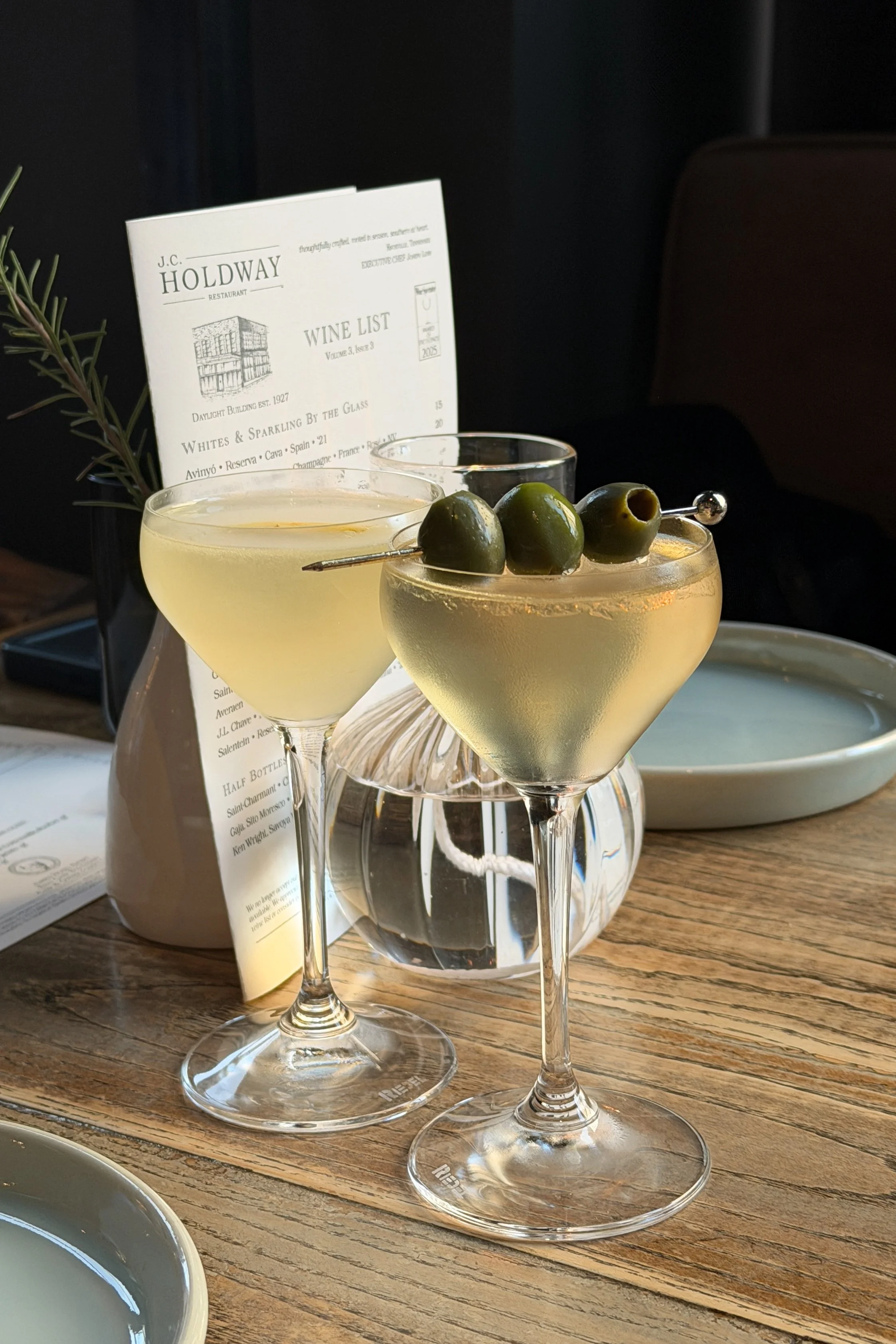 The French 75 and Dirty Martini at J.C. Holdway in Knoxville, served in matching V-based coupe glasses.