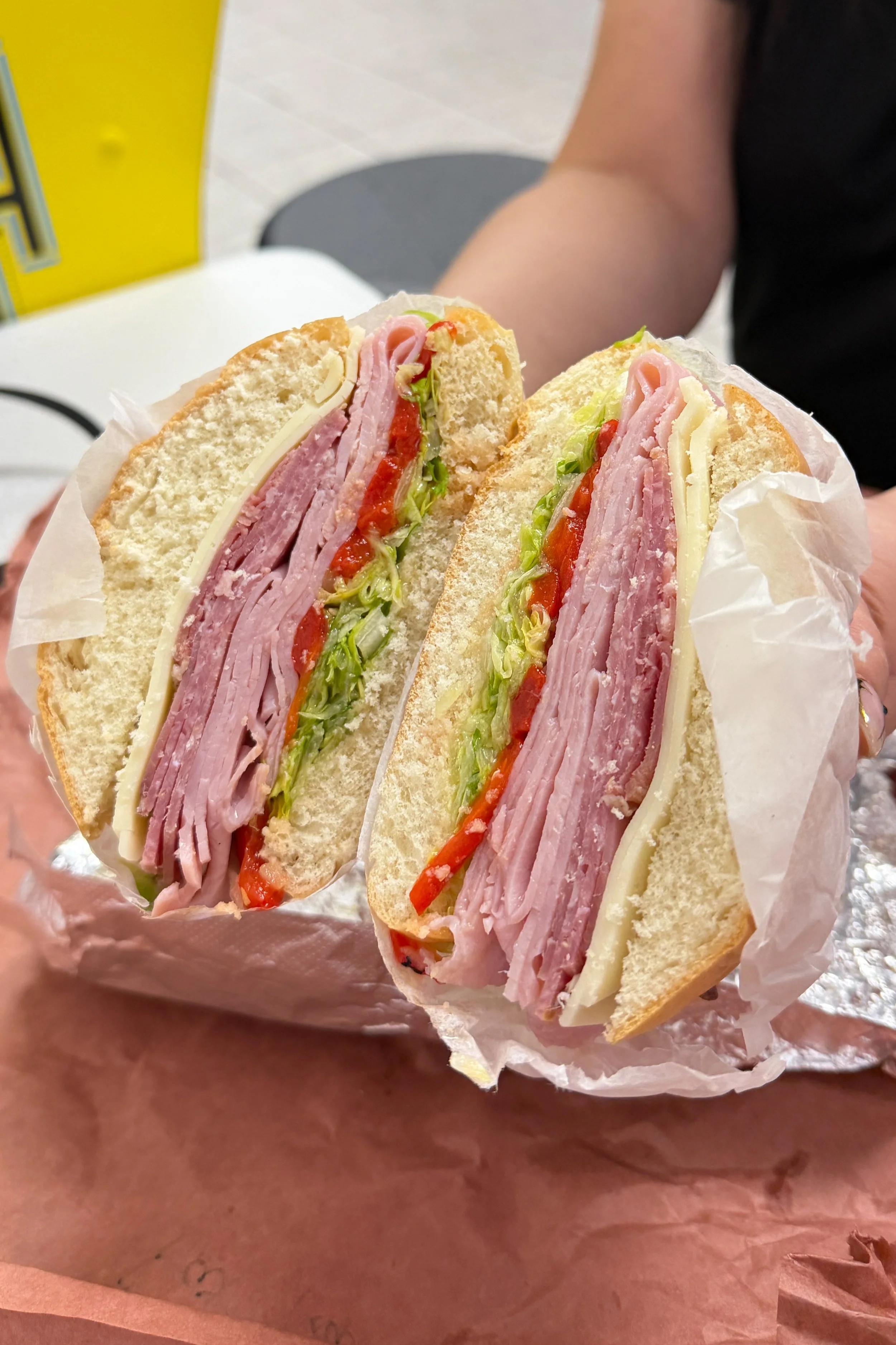 The Fat Italian sandwich at Mochi's Deli in Charlotte, stacked with ham, provolone, roasted red peppers, and lettuce.
