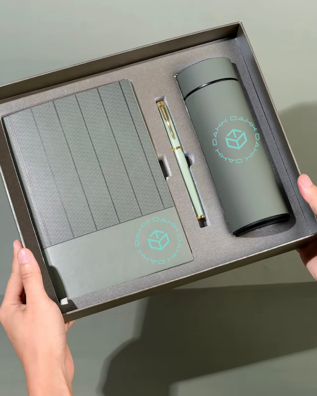 note book, pen and water bottle, with company logo for conferences and clients