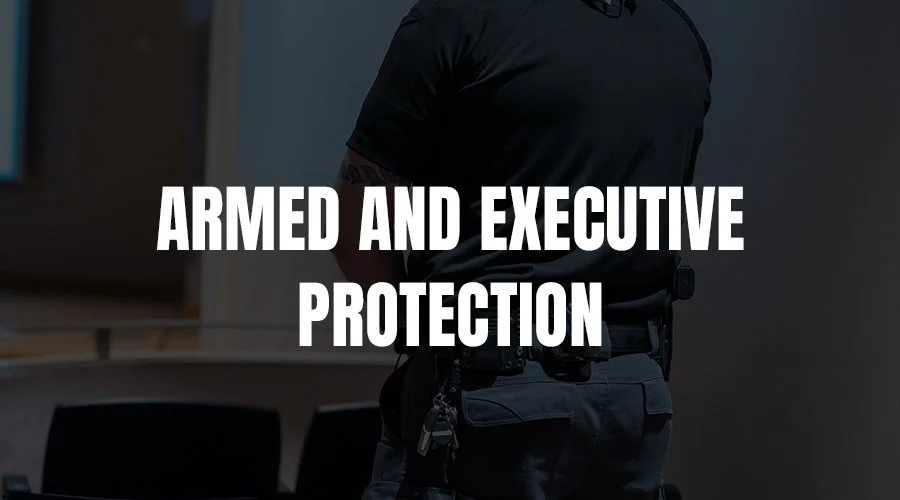 A security officer in uniform standing in a conference room with a table and chairs, with the text 'Armed and Executive Protection' overlaid.
