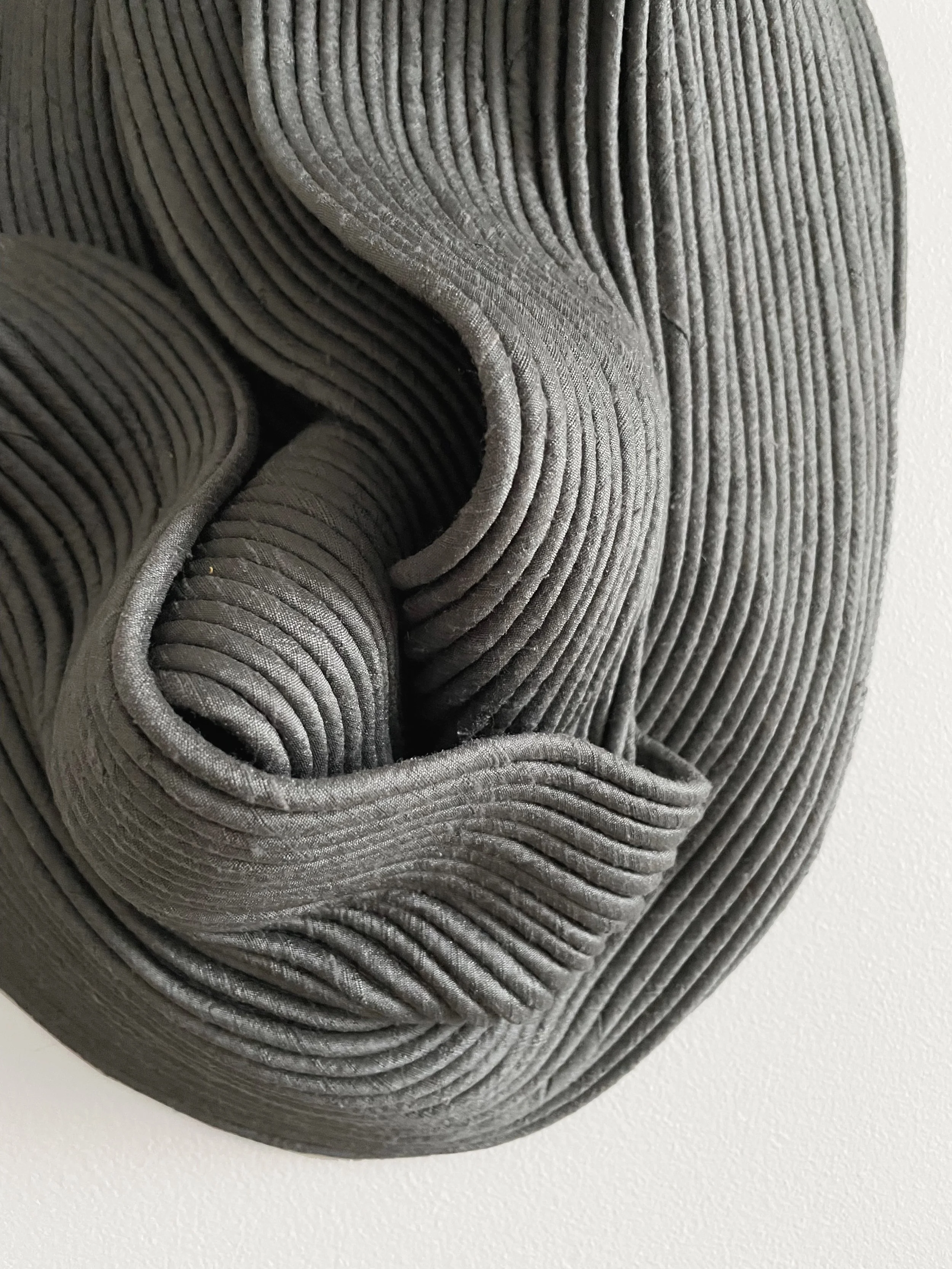 Antracite, 2023. 42x31x14cm. Dupion silk & recycled cotton cord. Backing hardened. Sold.