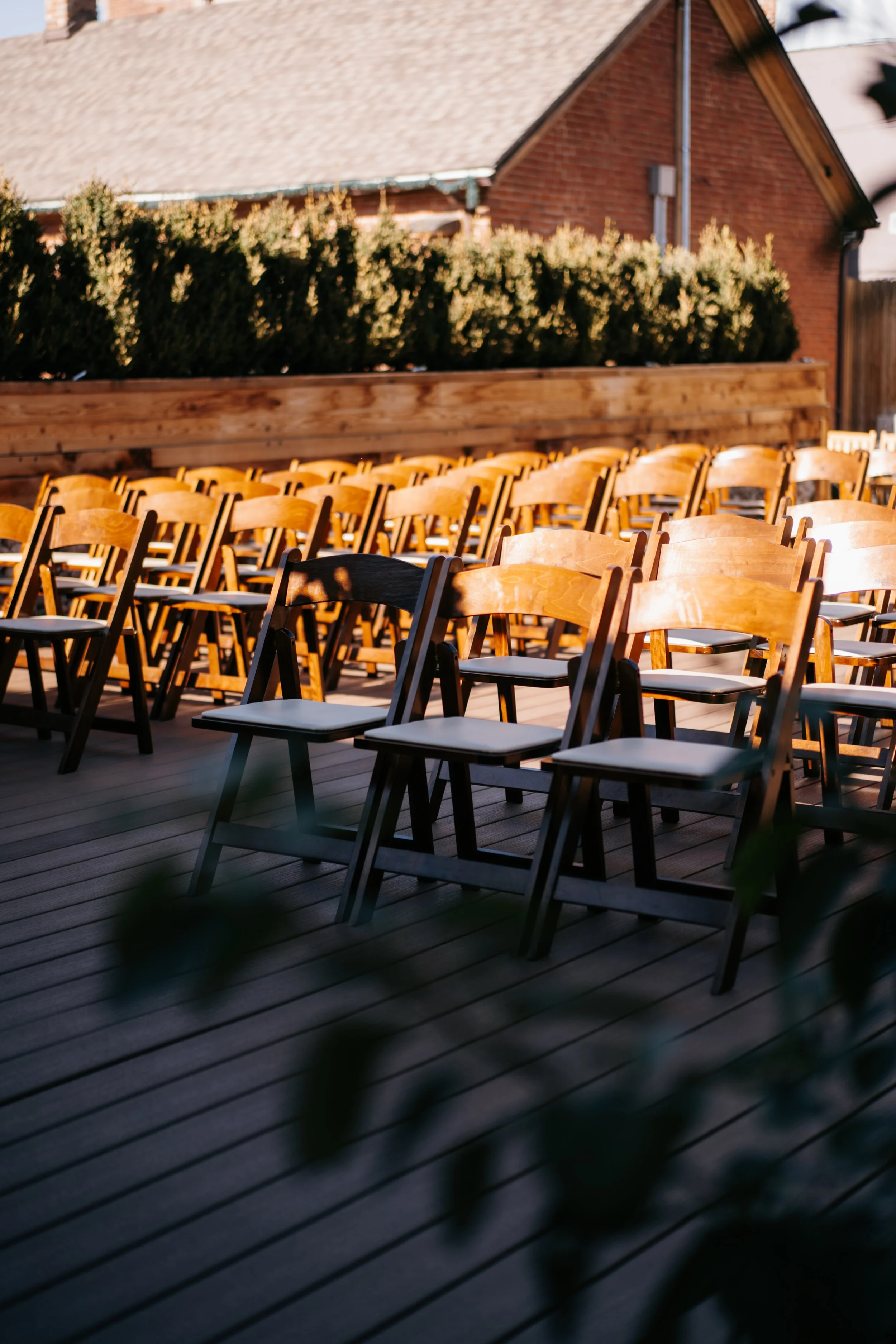 Outdoor wedding ceremony setup with rows of chairs and our Denver wedding venue
