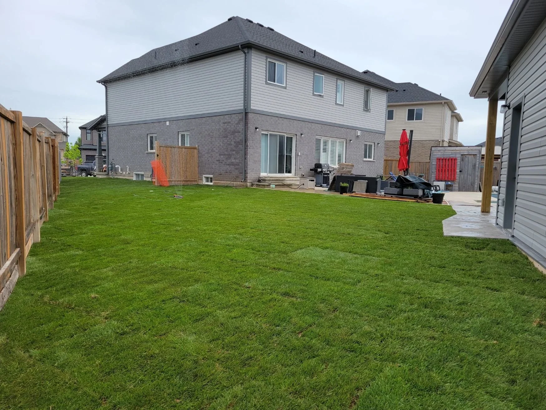 Premium Kentucky Bluegrass sod installation in Smithville, professionally laid by Gardenstone Landscaping.