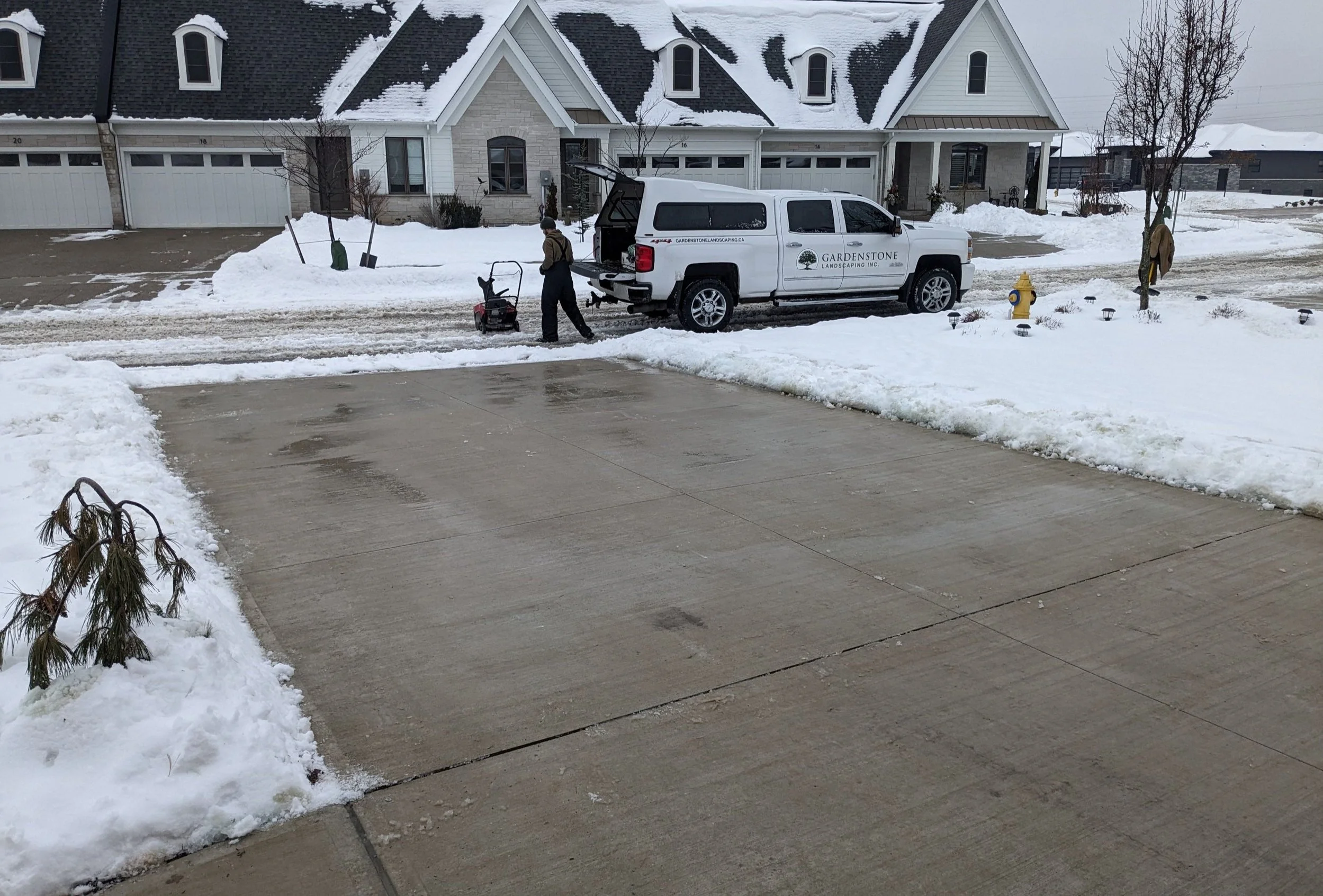 Gardenstone Snowcrew clearing a driveway in St. Catharines