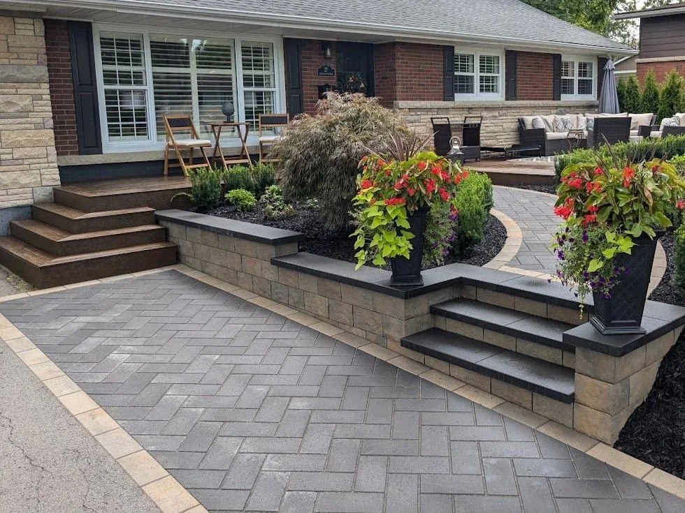 Modern interlock walkway in St. Catharines using Techo-Bloc Blu 80 pavers in herringbone and Brandon retaining wall.