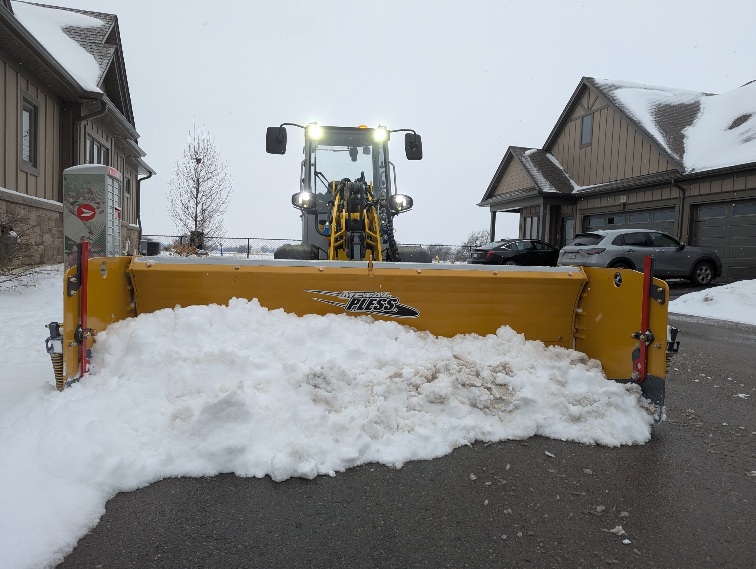 Snowplow pushing snow in Smithville