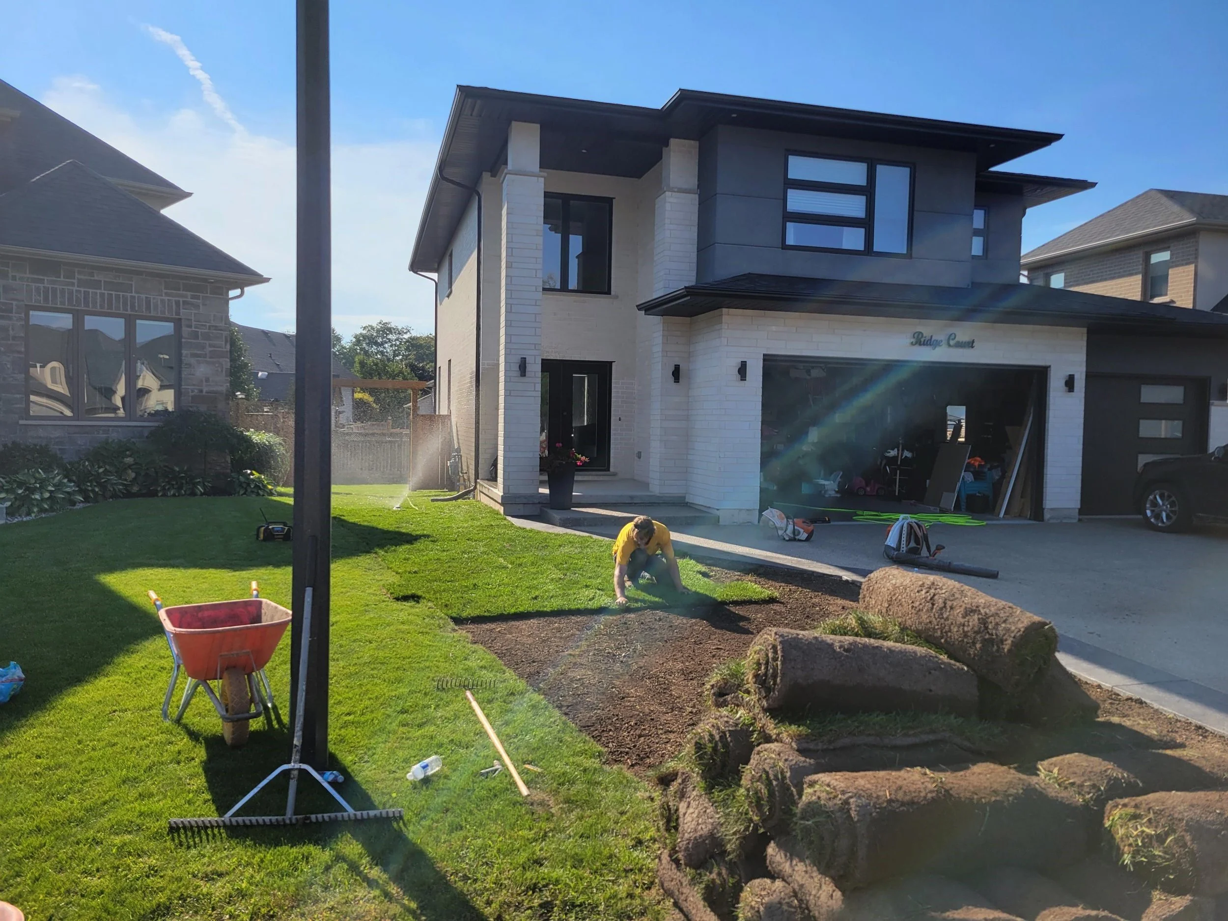Professional landscaping crew installing new sod in Welland.
