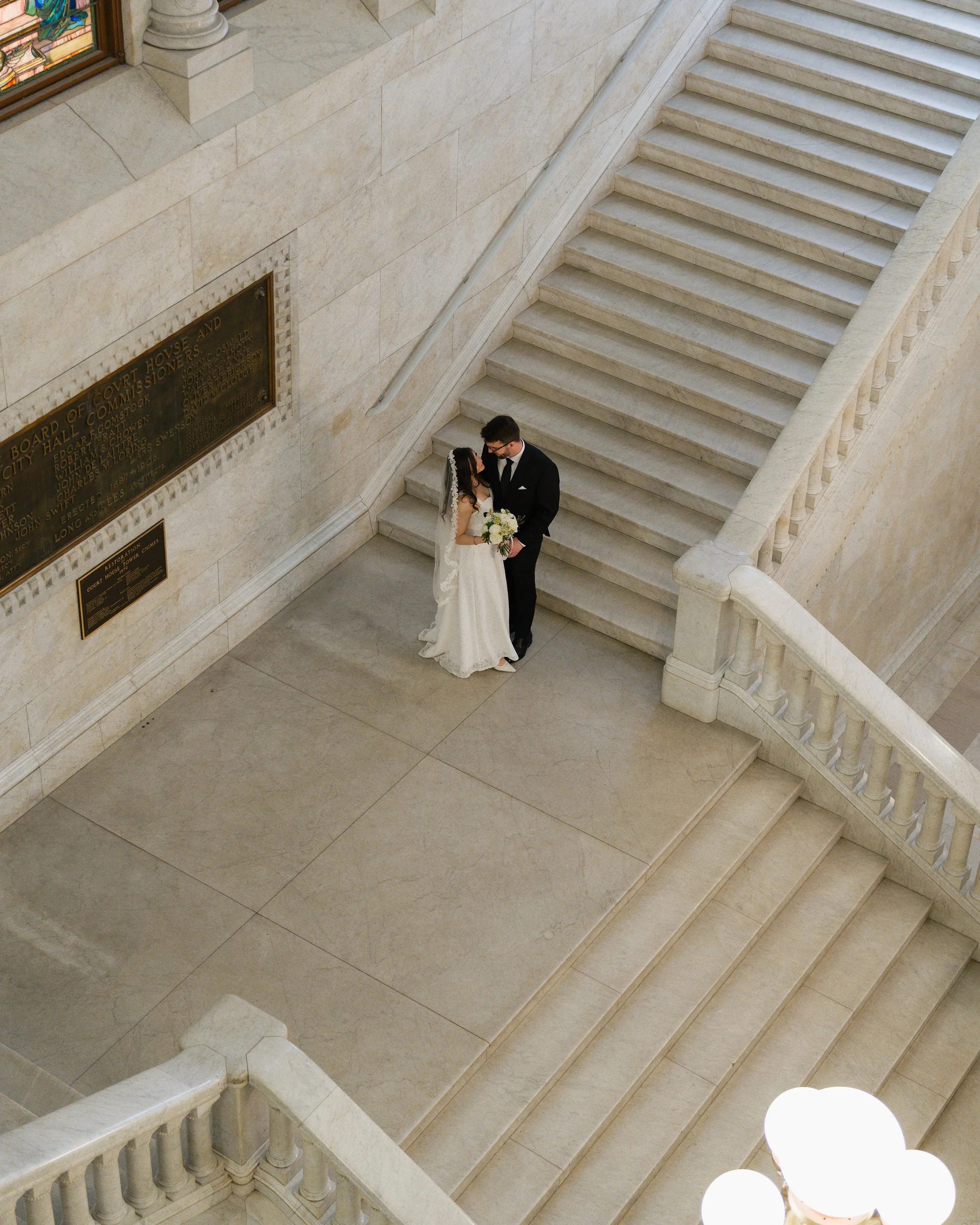 My favorite part about being a wedding photographer is how couples make the day their own. Wendolyn &amp; Sam chose to get married at the Hennepin County Courthouse with Sam&rsquo;s family. Wendolyn is originally from Peru, and her family is still th