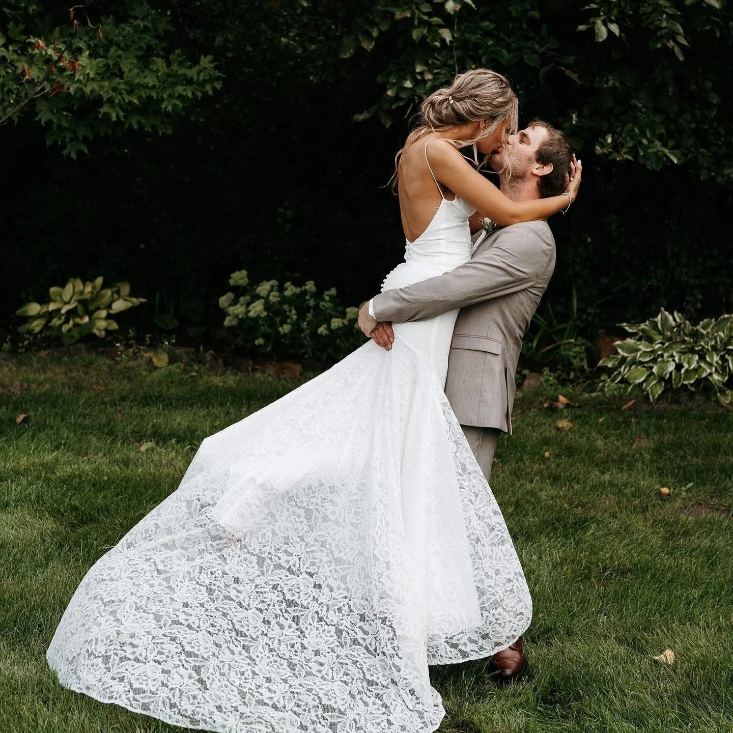 Bride and groom share a kiss captured by Tonya Hjort Photography