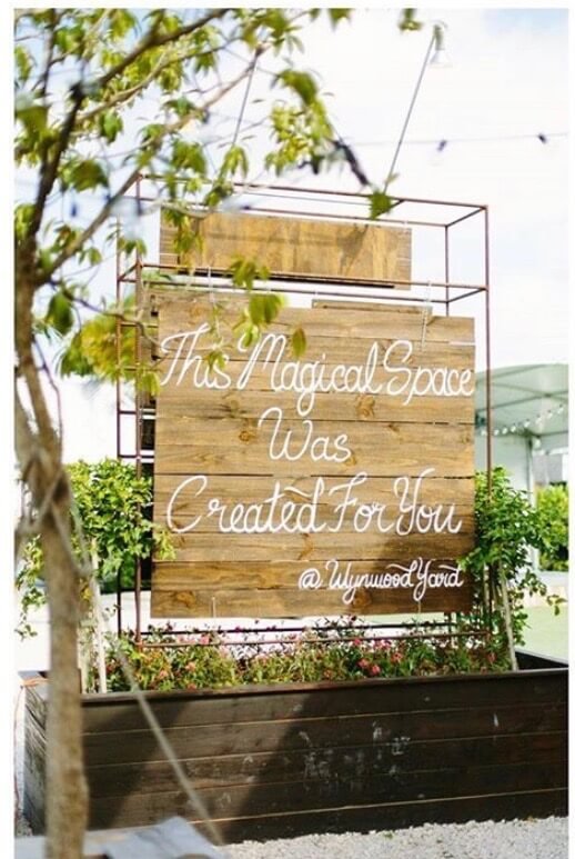 Event venue signage that reads "This magical space was created for you"