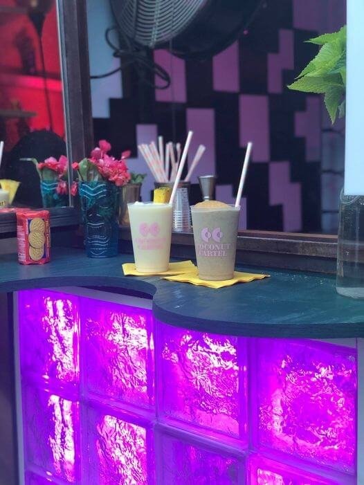 Event Bar for frozen drink brand activation - two drinks set up on top of a purple lit bar