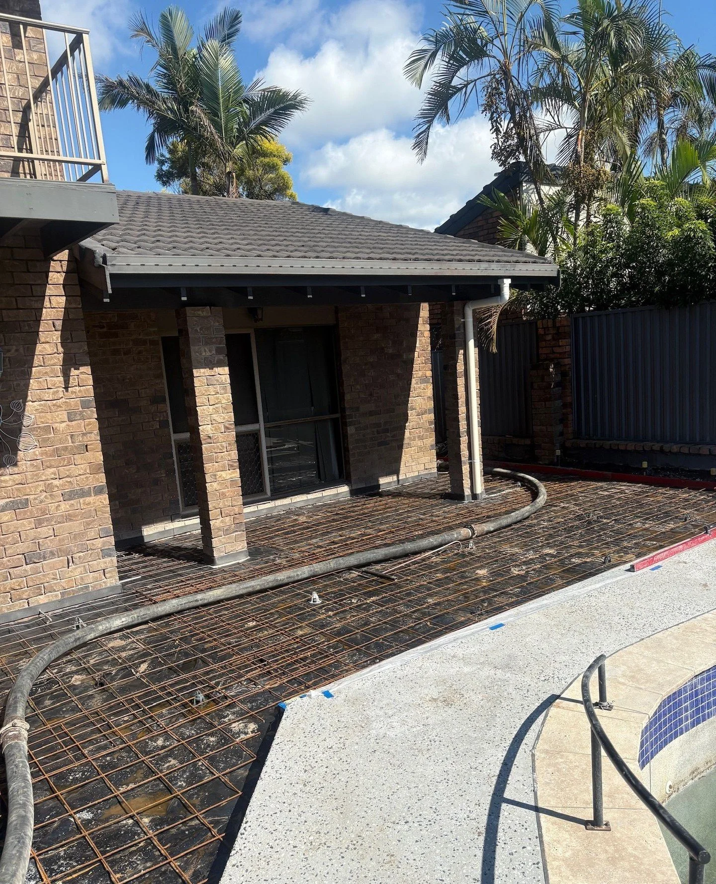 Poolside and surrounds fully prepped and poured last week, finished in exposed aggregate to completely transform the space. Swipe to see the results.