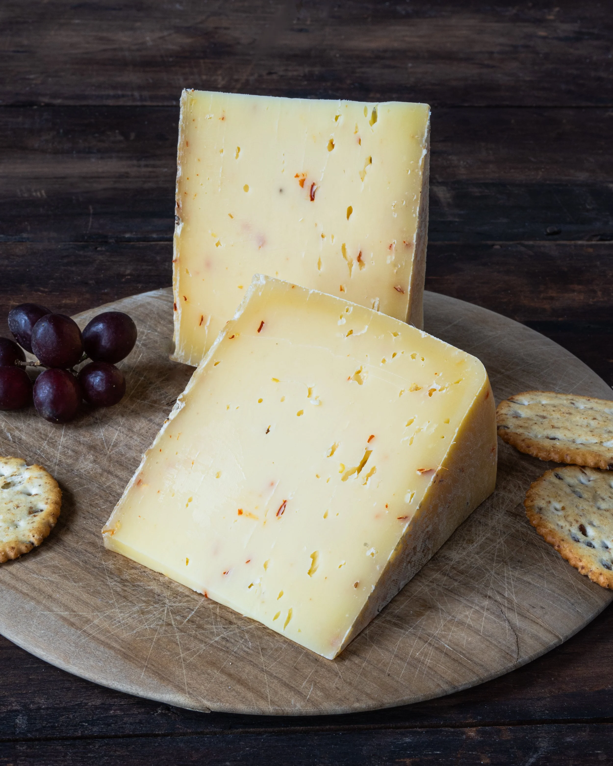 wedge of cheese with pepper flakes