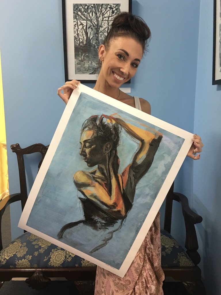 Print of the prima ballerina Teagan Lowe. Painted in mixed media, she is looking down and has her arms holding her face and head. Teagan is holding her namesake print.