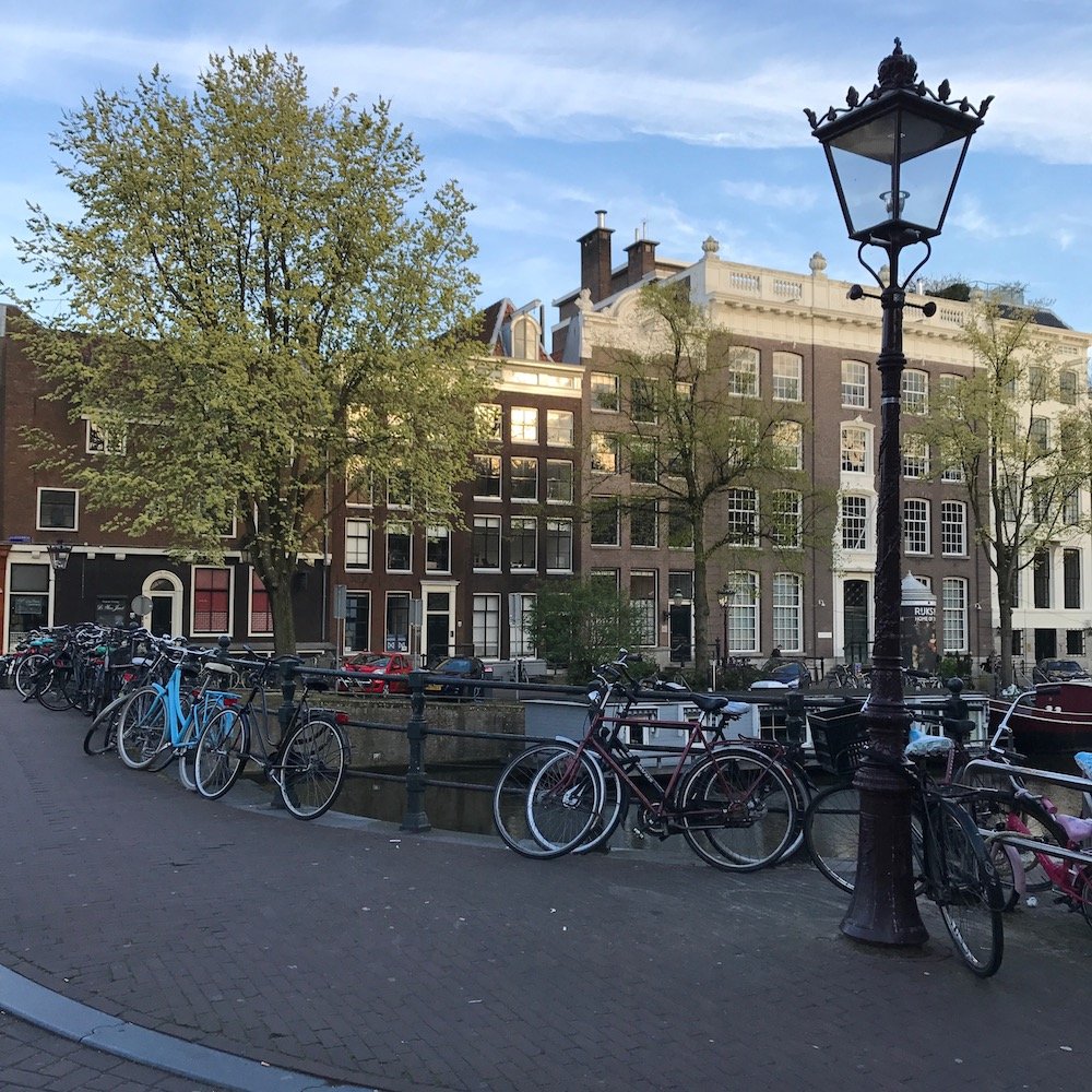 Amsterdam-bikes-on-canal-bridge.jpeg