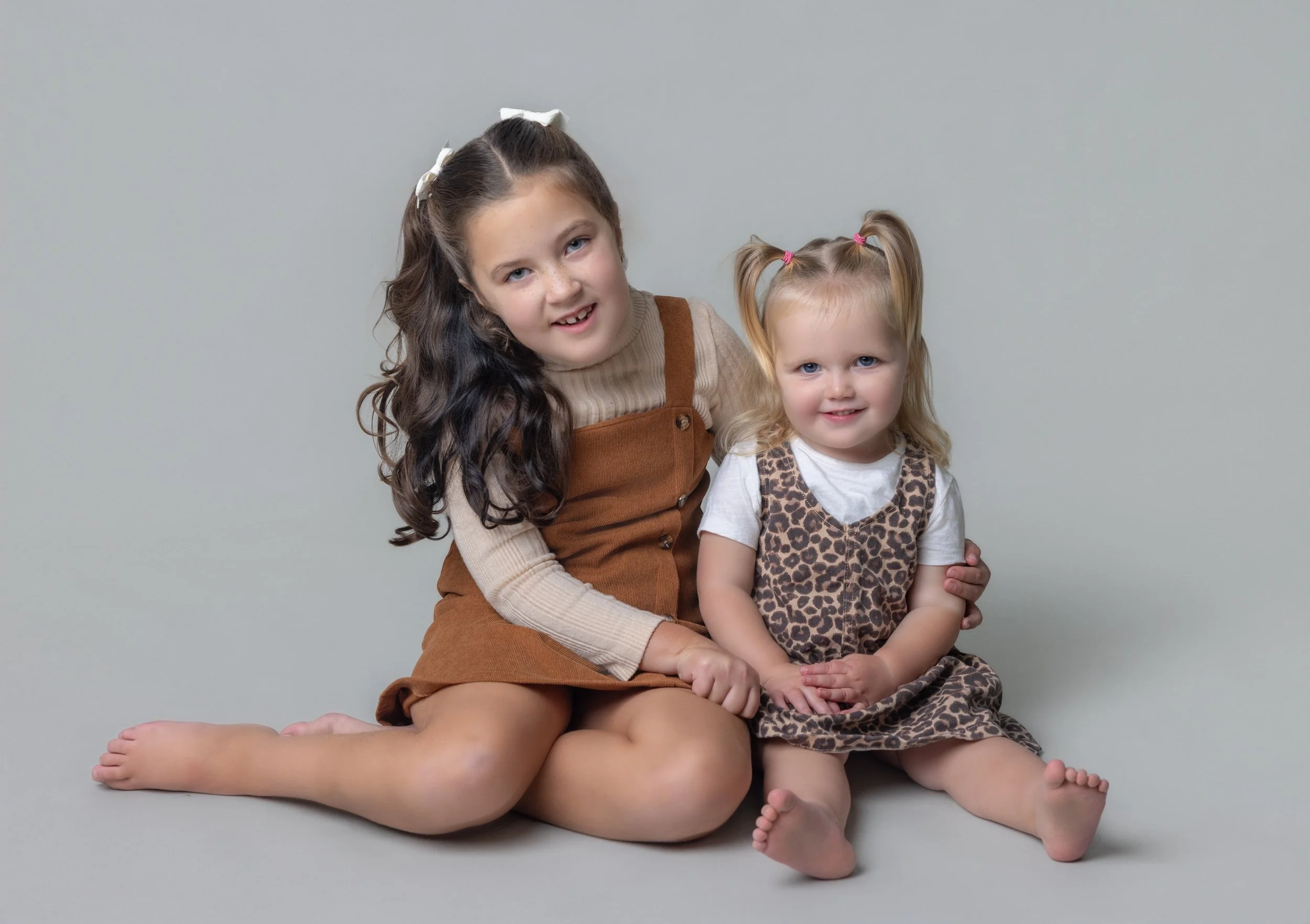 COUSINS HAVING PICTURE TAKEN