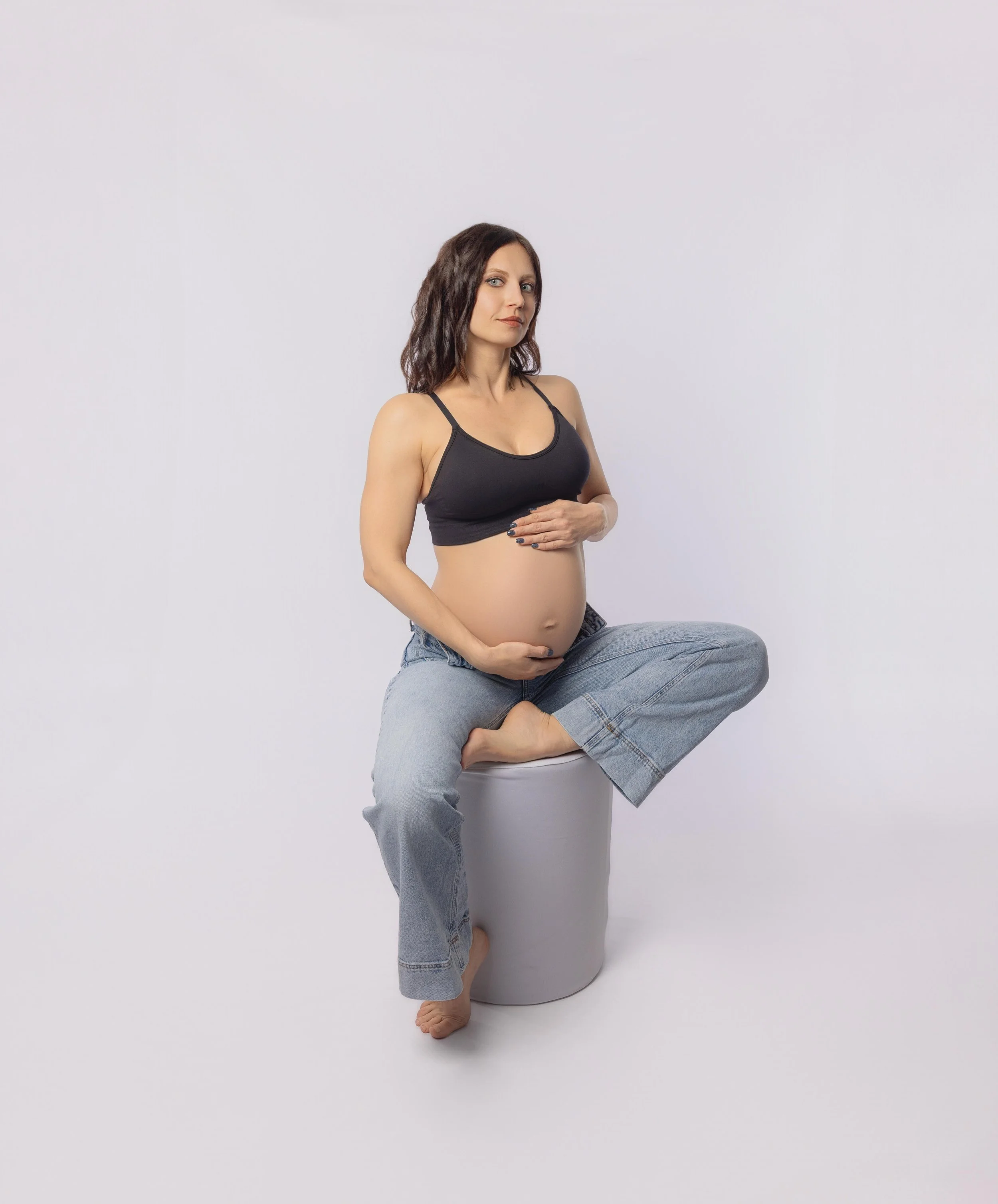 pregnant lady sat in a stool