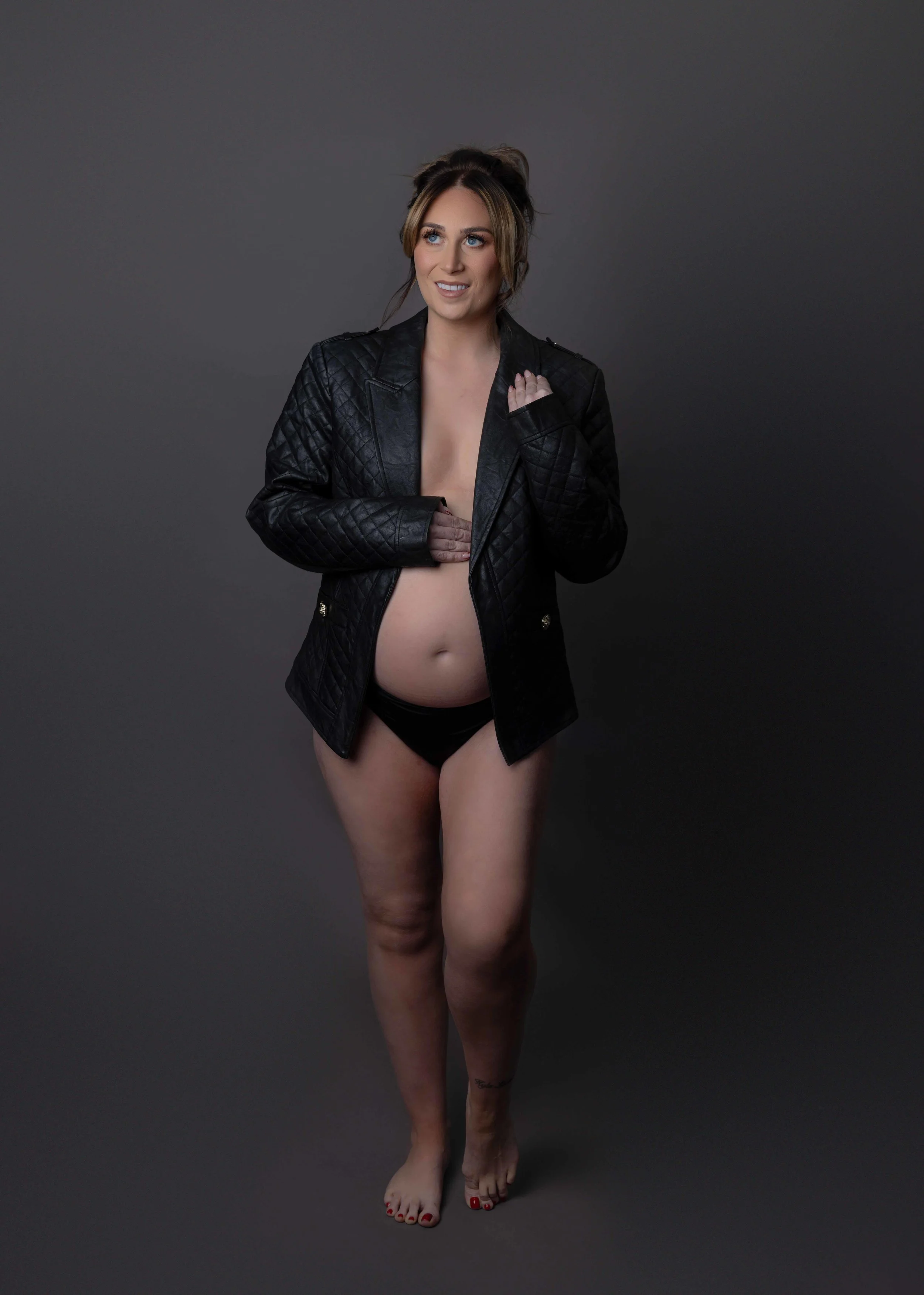 pregnant lady wearing leather jacket