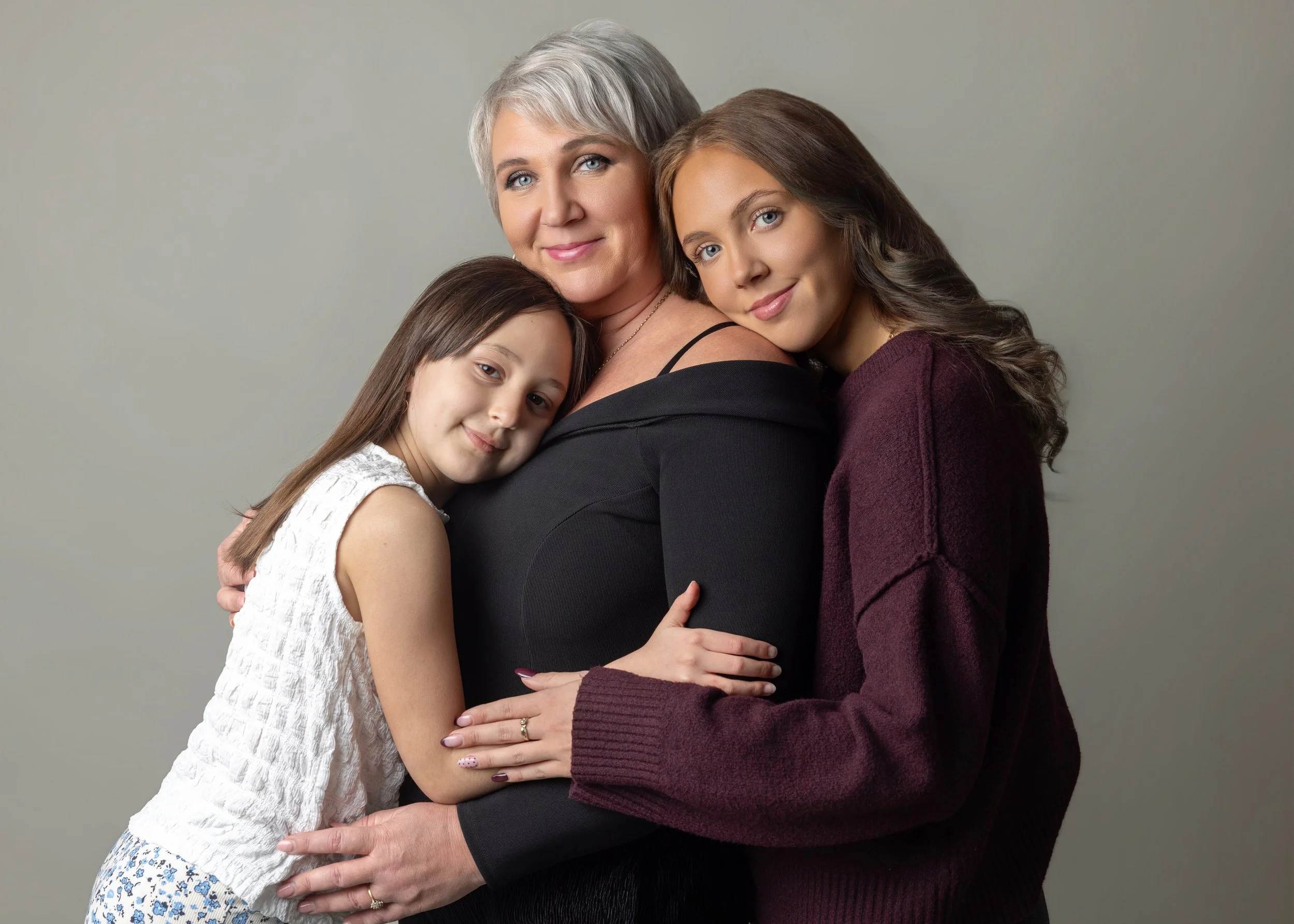 mum and two daughters on a photoshoot