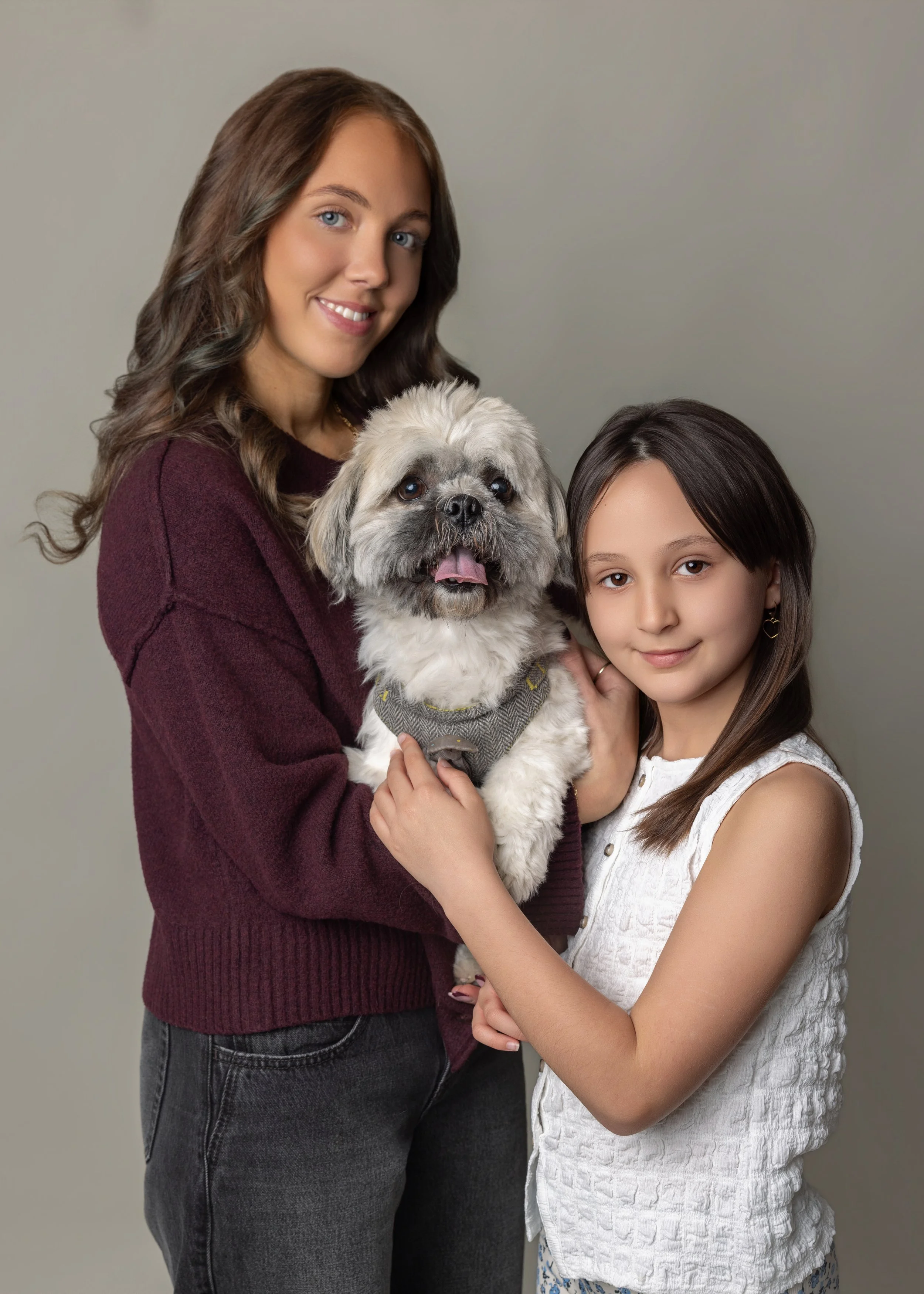 sisters with dog on a photoshoot