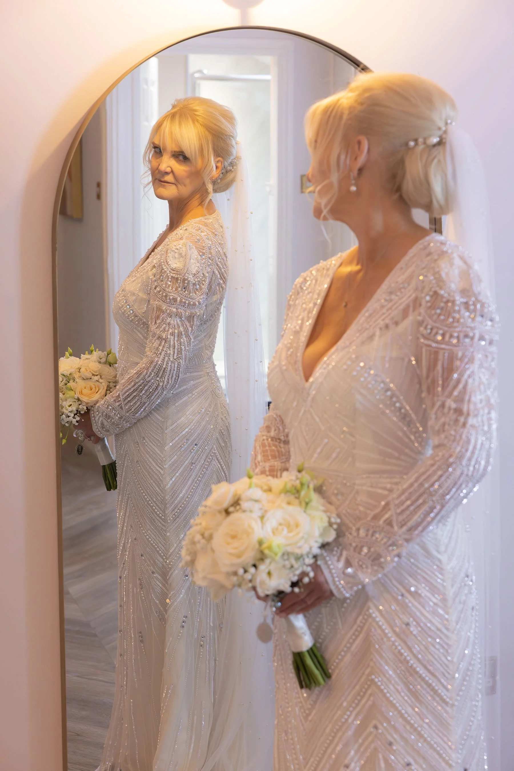 bride looking in mirror