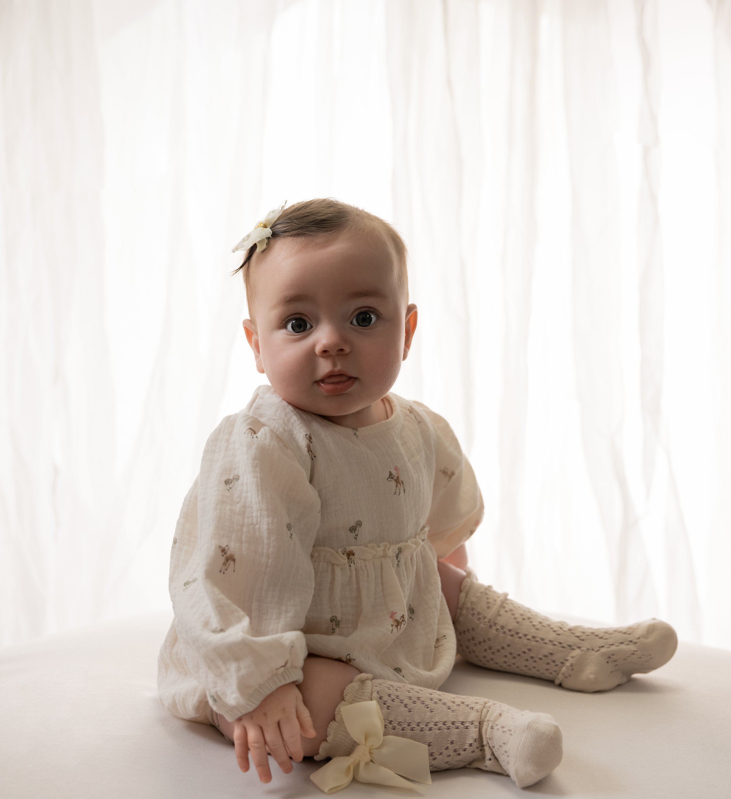 baby looking at camera on a photoshoot