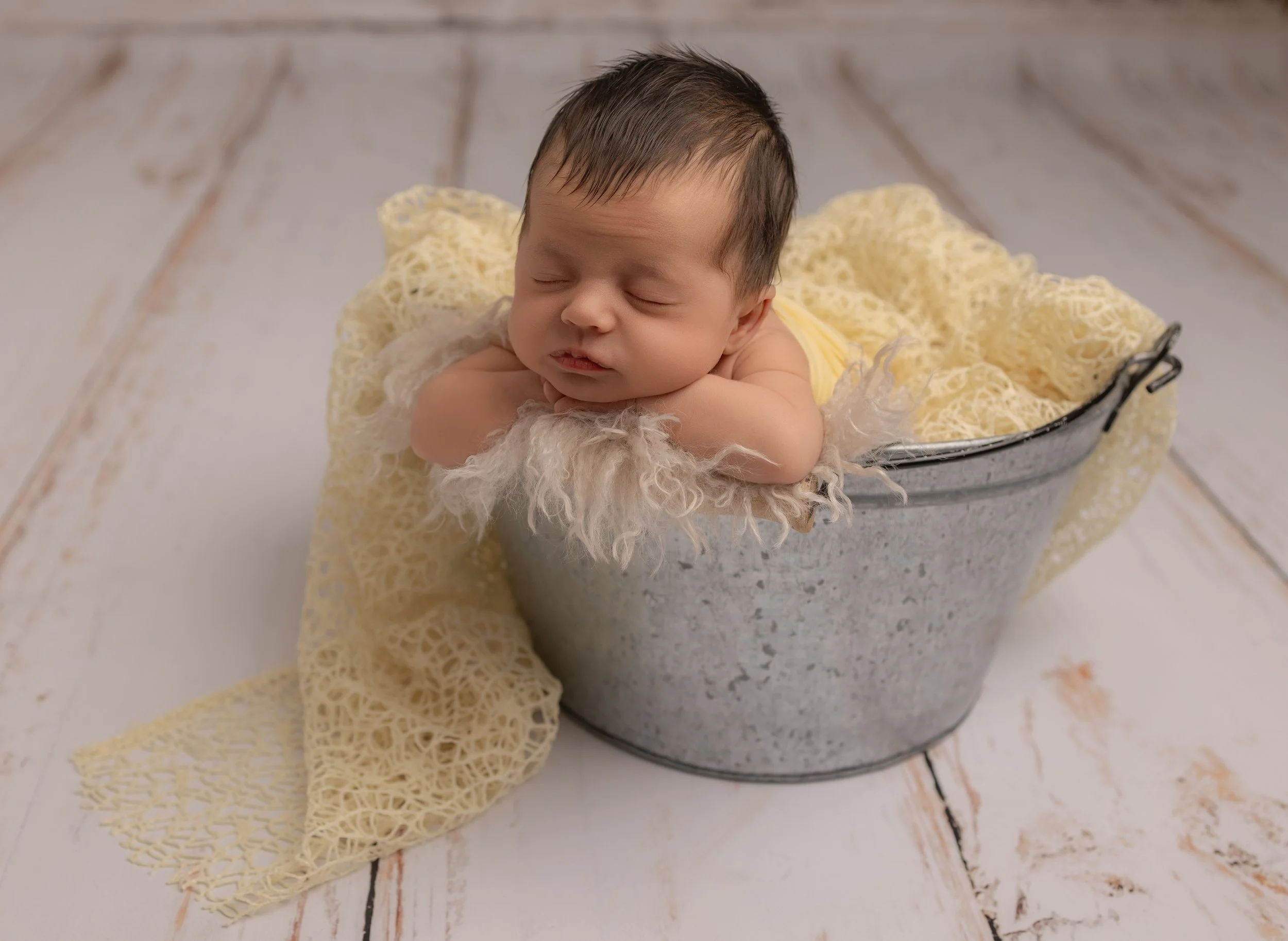 newborn baby in lemon 