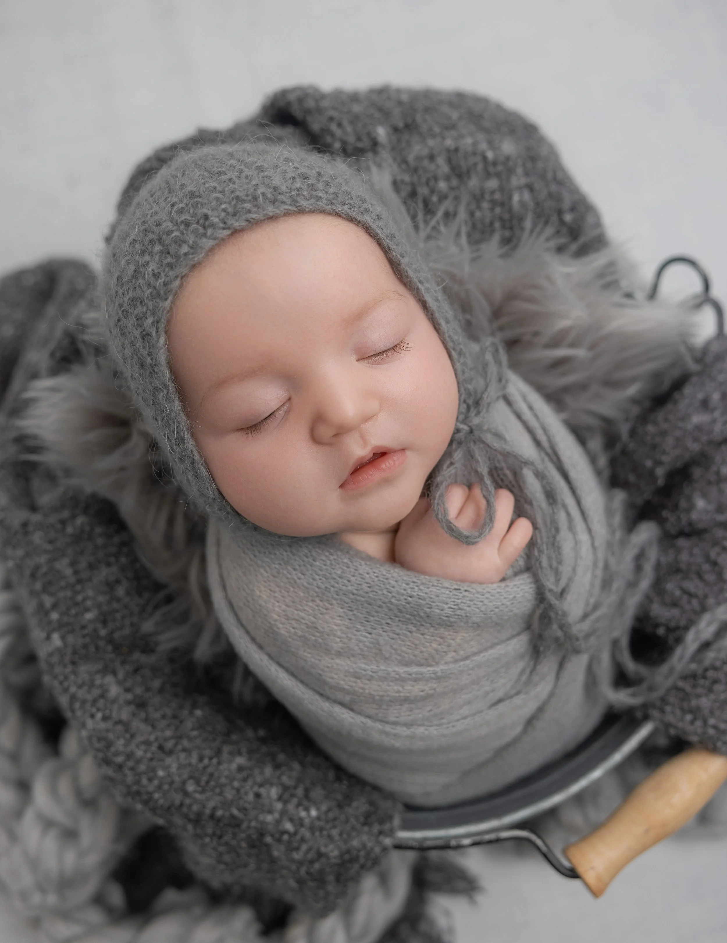 newborn baby swaddled