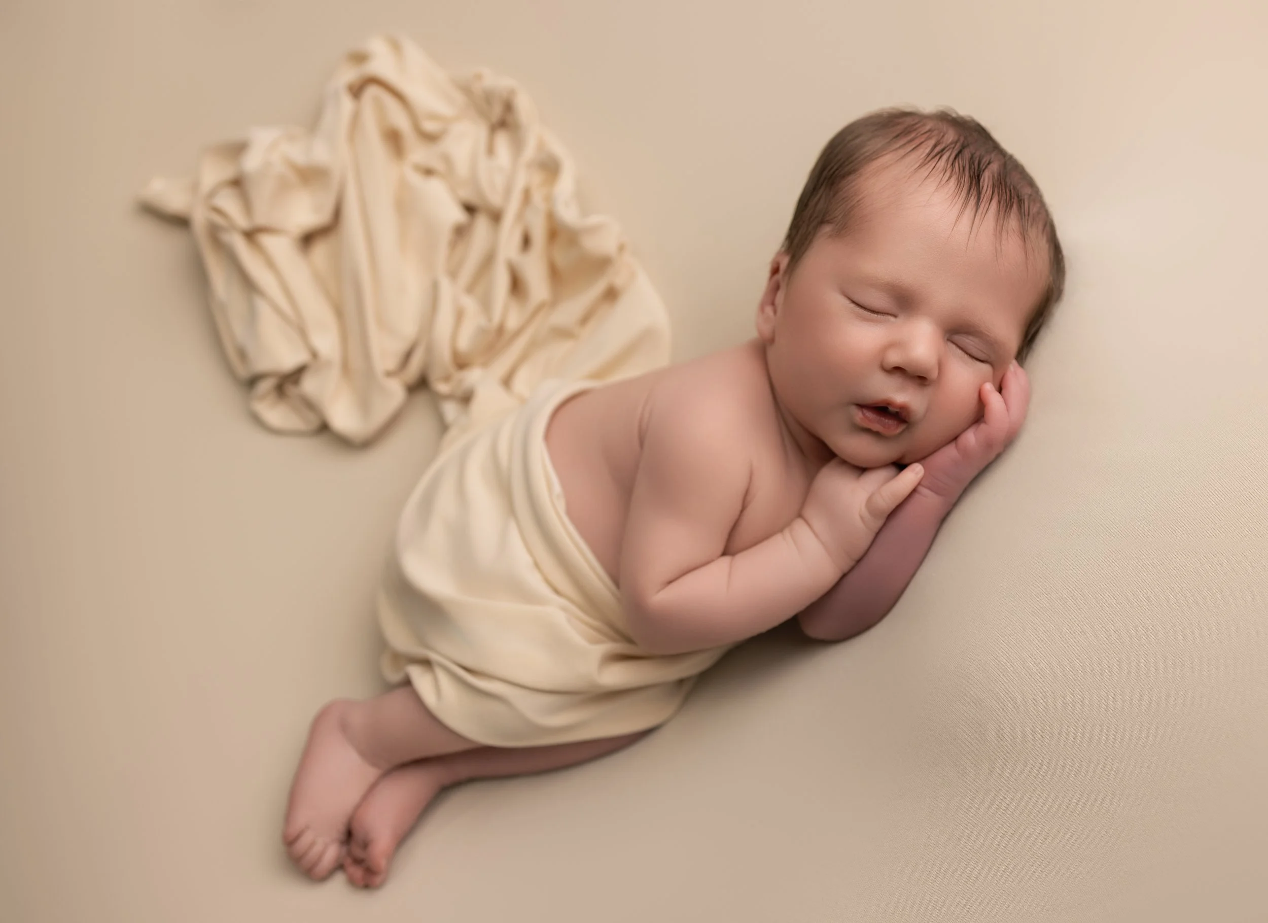 baby led on his side asleep