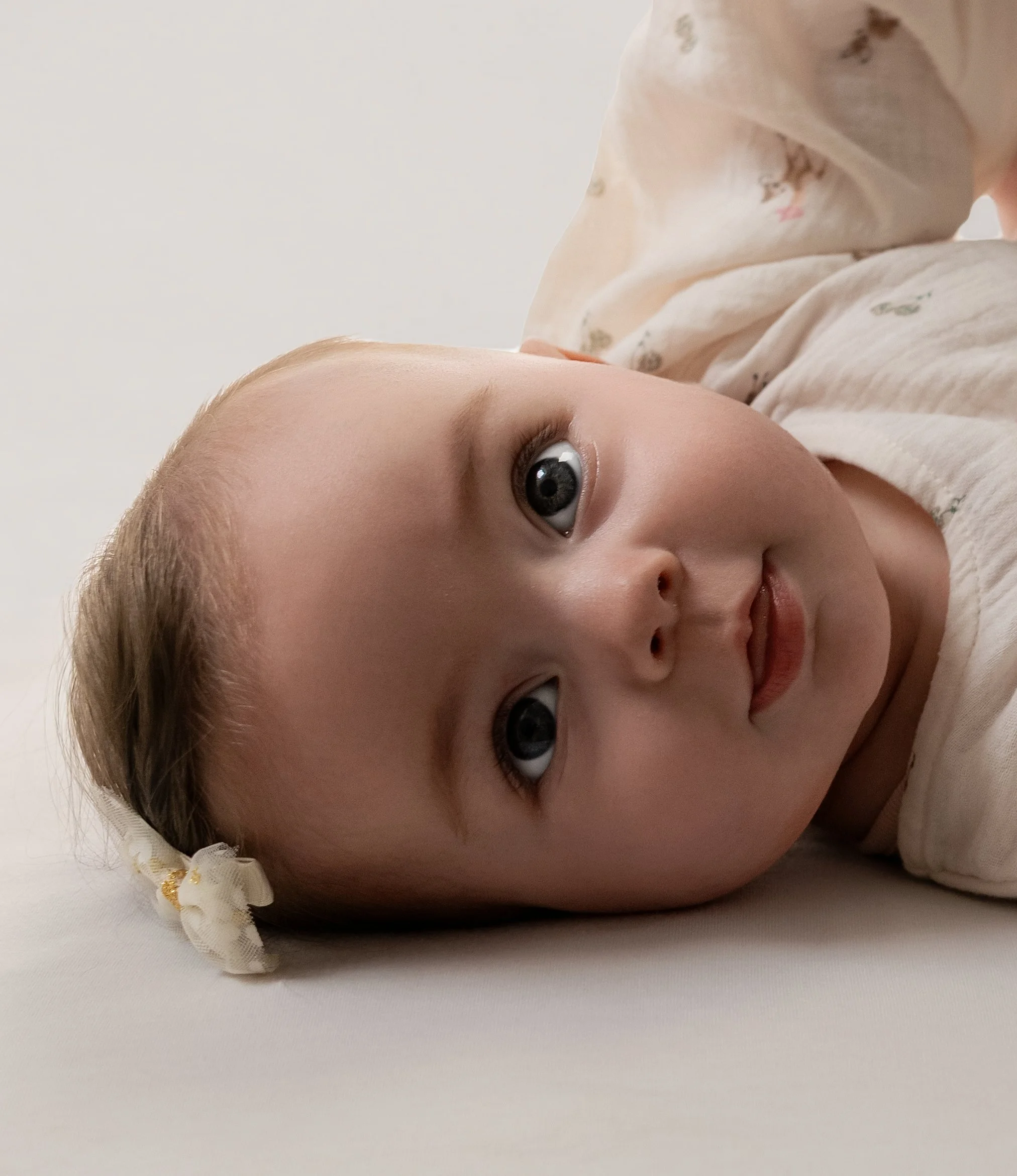 baby led on back looking at camera