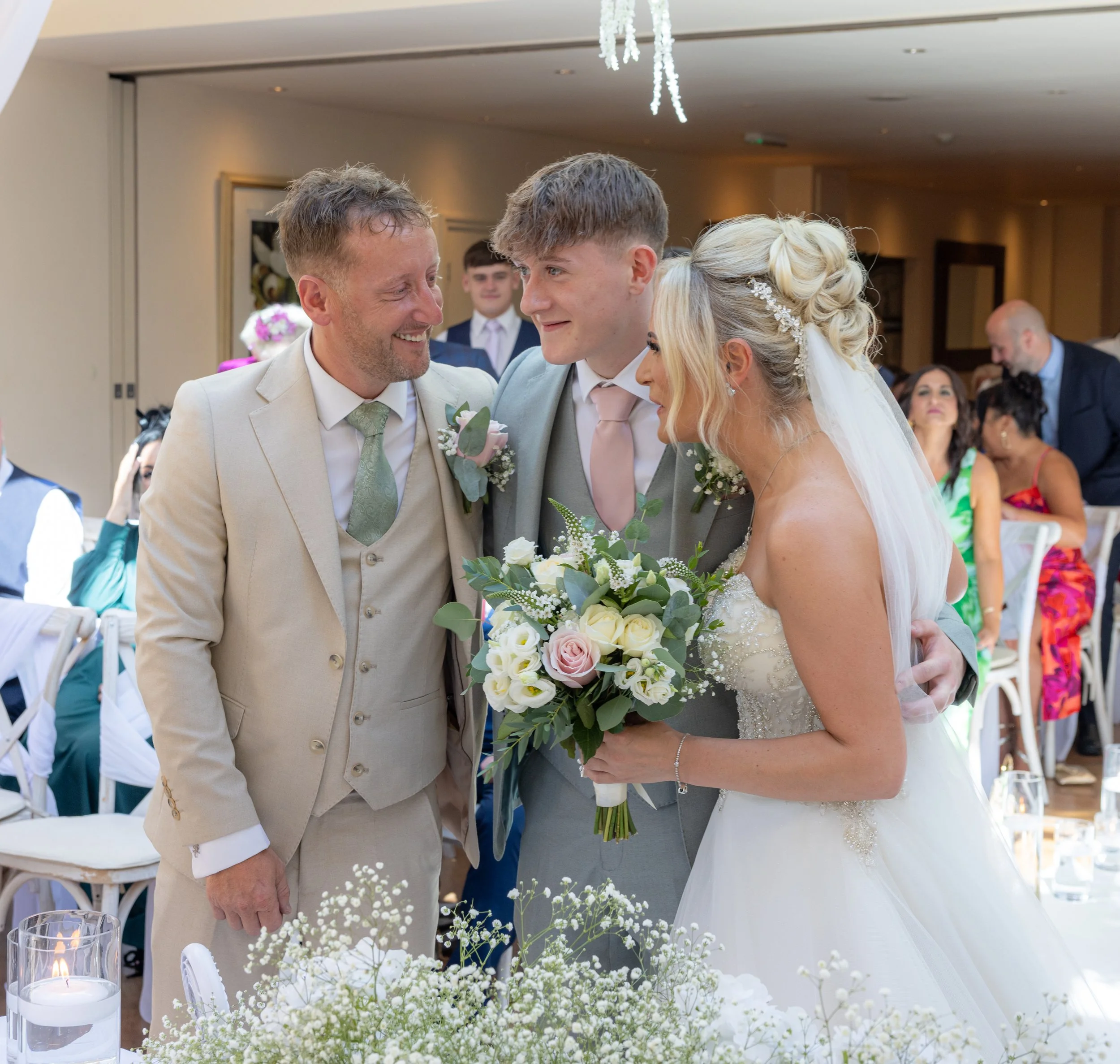 bride, groom and son