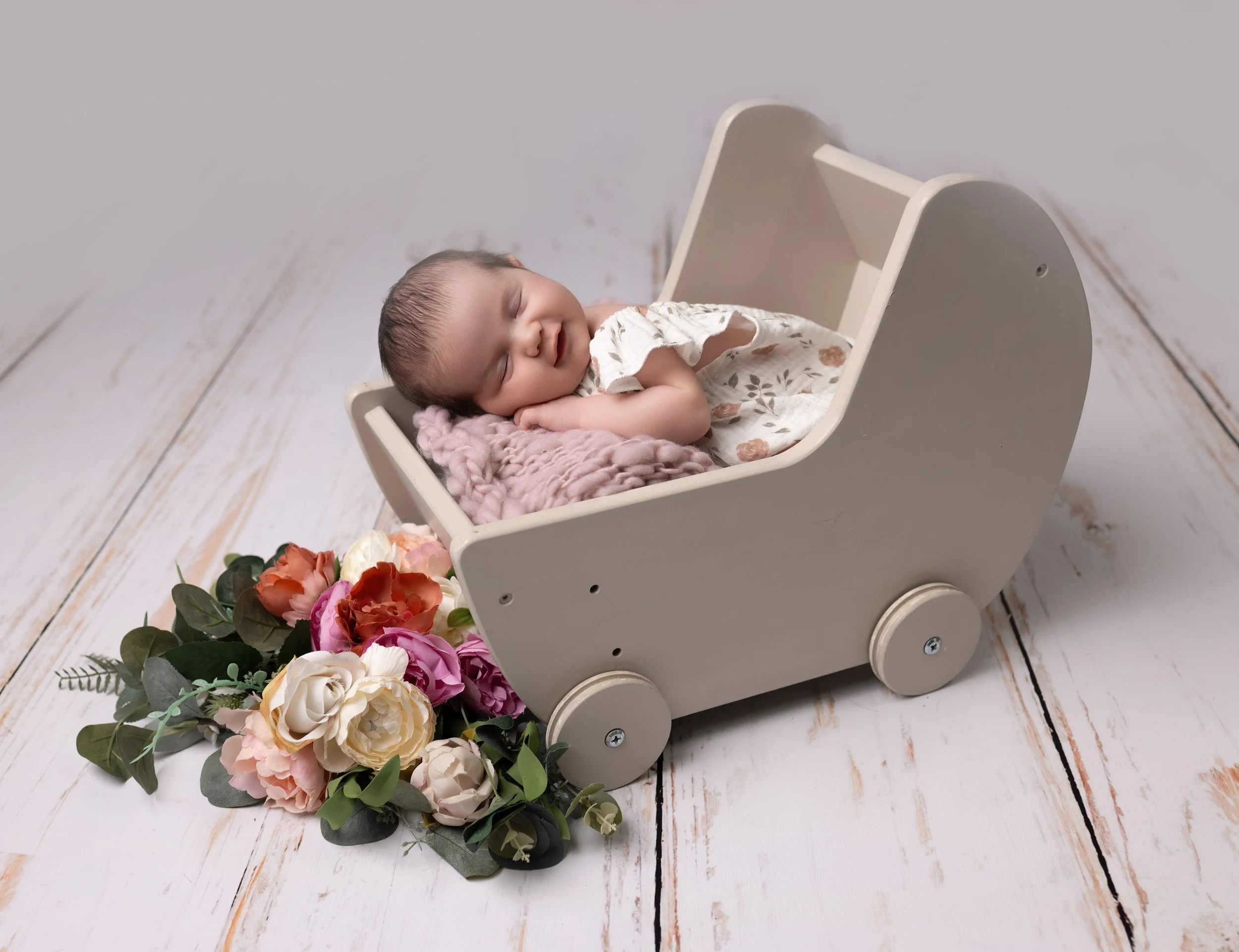 baby asleep in a photography prop