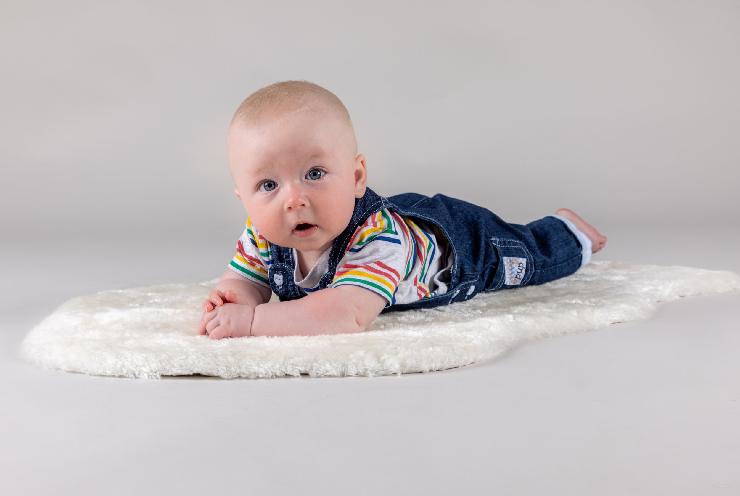 baby led on a rug