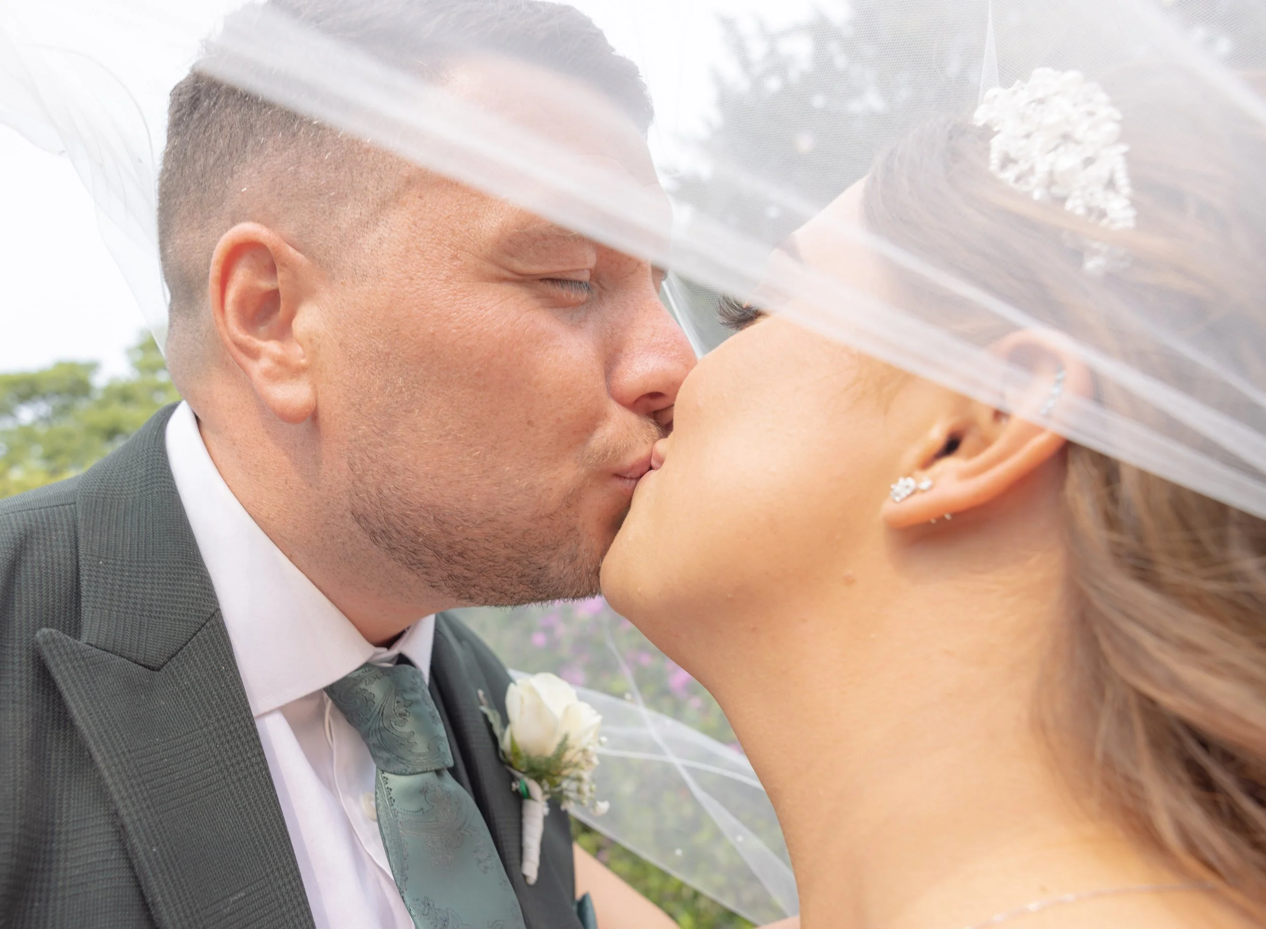 Bride & Groom Veil Kiss