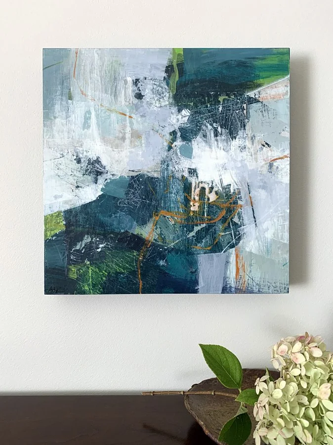 An blue abstract with a white hydrangea.