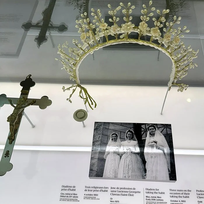 A tiara, cross, gold band and photo of nuns circa 1960.