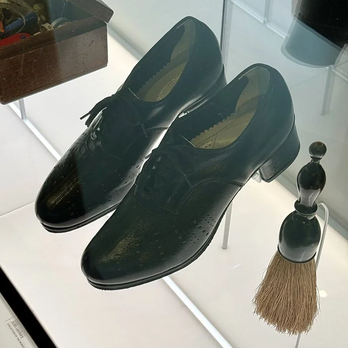 Sturdy black shoes of a nun.