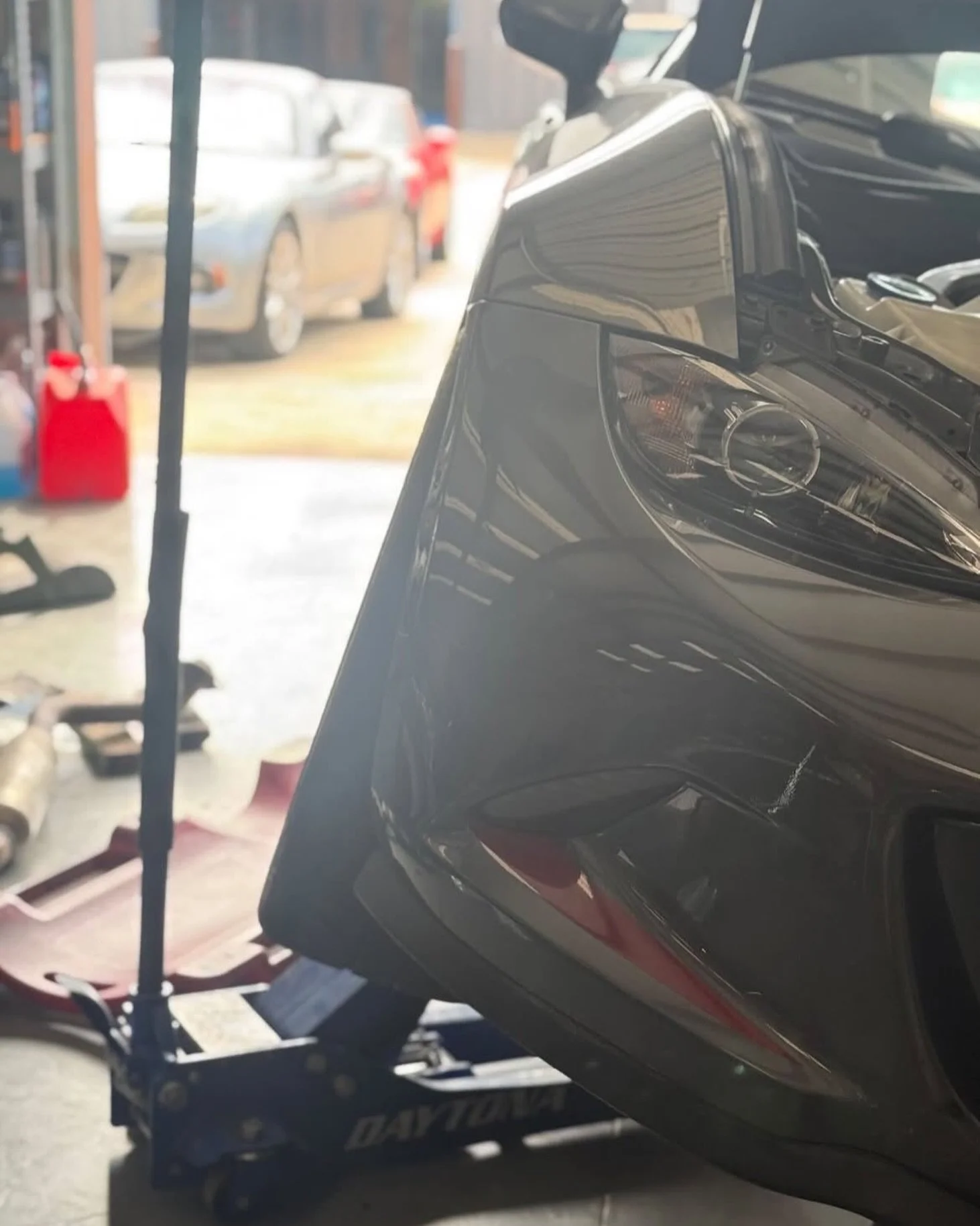 #NDmiata sitting sideways in the shop while the midpipe is replaced. #arhindrichsllc #houstonmiataclub #houstonmiatagroup @houstonmiataclub